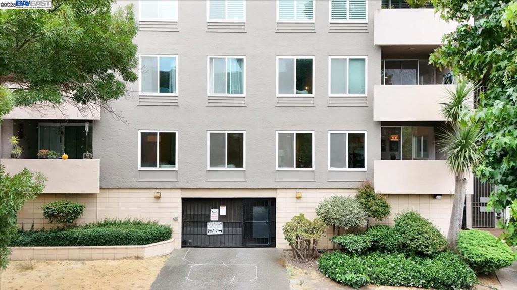 Welcome to 330 Vernon Street #107, a stylish first-floor corner unit in Oakland’s vibrant Adams Point neighborhood. This bright and airy 2-bedroom, 2-bathroom condo offers 1,119 sq. ft. of thoughtfully updated living space. The spacious living room is bathed in natural light from large picture windows and flows seamlessly into a cozy dining area, which opens to a covered balcony perfect for enjoying morning coffee or winding down at sunset. The updated kitchen features built-in open shelving for both convenience and stylish display, a dishwasher, recently refurbished cabinets, a new stovetop, a designer faucet, fresh paint, and a charming eating nook. Beautifully updated bathrooms boast stylish tile flooring, tiled tub and shower surrounds, sleek vanity countertops, and modern light fixtures. The primary suite offers generous space and a walk-in closet, while the second bedroom provides ample room and abundant storage. Recent upgrades include fresh interior paint throughout, new door hardware, and updated lighting. Just steps from Whole Foods, Lakeside Park, and Lake Merritt, with BART, diverse shops, dining, and scenic parks nearby, this unit blends comfort, style, and a prime location.