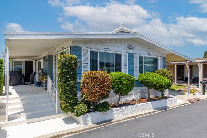 Lovely Double Wide and Partial Triple Wide 2 Bedroom, 2 Bathroom Mobile Home in an Outstanding 55+ Community of the Whittier Downs.  This Home is Ready To Move Into.  Built in 1978 and Well Maintained, Features a Covered Porch Entry into a Front Carpeted Living and Dining Area.  The Kitchen has Stainless Steel Appliances, Bosch Cook Top Gas Range, Frigidaire Gas Oven, GE Double Door Fridge, Frigidaire Dishwasher with Formica Counter Tops and Breakfast Bar. Additional Family Room Mid Center of Unit with an Additional Sliding Door Entry Off of Covered Porch.  Newer Dual Paned Windows, Large Master Bedroom with Walk In Closet and Adjoining Full Bathroom.  Second Bedroom Offers Ample Space and an adjoining .75 Bath.  There is a Separate Laundry Room with a Separate Entry Off the Carport Which Has Enough Space for 2 Vehicles Parked Tandem.  There is also a Workshop Off of the Carport.  Newer Central Air Condenser, Soft Water Unit and Patio Area At Rear of Unit. Roof is Composition. The Space Rental is $2,019 per Month.  There is Ample Grocery Shopping, Dining and Entertainment within a Block of this Fine Property.  Whittier Downs Park Offers Automatic Gate Entry, Large In Ground Pool, Large Hot Tub, Sauna and A Large Club House with Kitchen and Dining Area.