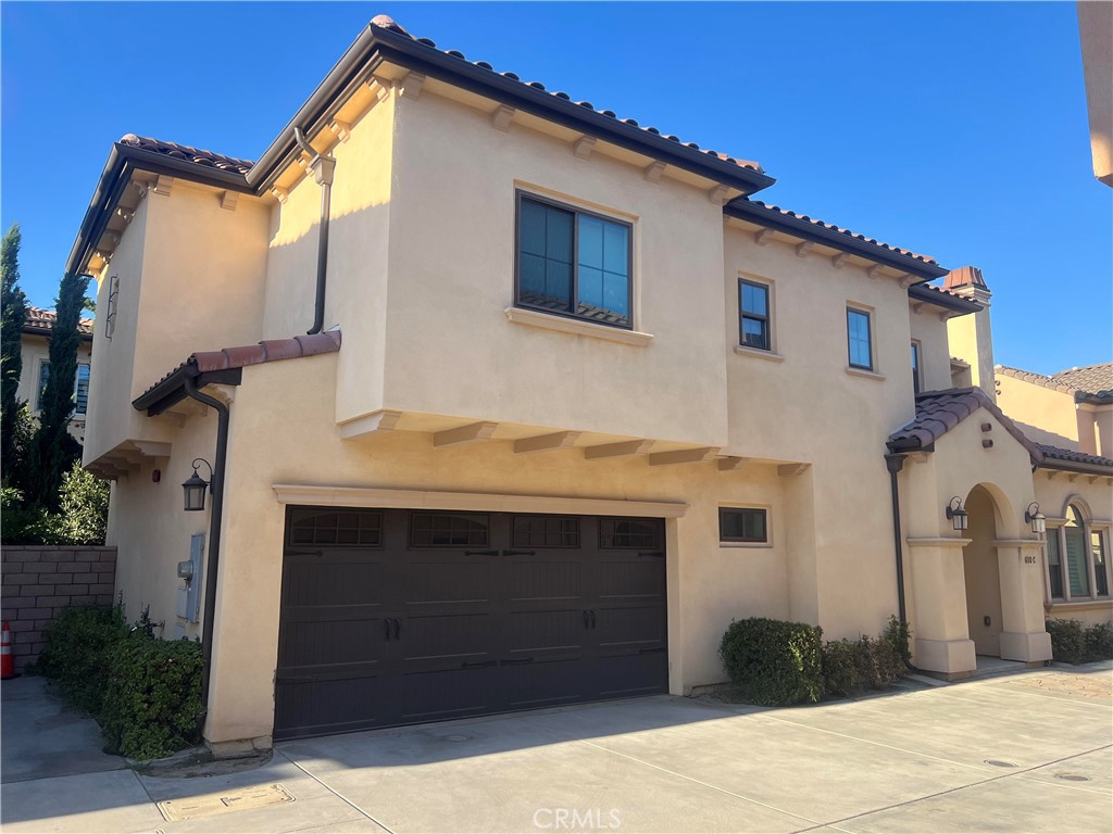 A deluxe detached condo (PUD) is situated at a gated community. The total 8 units complex is located at the best and heart of Arcadia. The community is luxurious, comfortable and convenient. It's minutes away from Santa Anita Park, Westfield shopping Mall & Golf course and the top-rated Arcadia Schools. Excellent floor plan: 4 bedrooms and 4 bathrooms. One bedroom and one bath on the main floor. Master bedroom, two suite bedroom and a loft/family room on the 2nd floor. Walk-in closet. Marble floor Foyer, Quartz countertops, Spacious living room with a fireplace. Formal dining room with a sliding door leading to a private and cozy backyard. Gourmet kitchen with stainless steel appliances. Recessed lighting. Wood floor downstairs & carpet upstairs. Smart thermostat.Tankless water heater. Two car attached garage and one assigned guest parking space. And so much more!