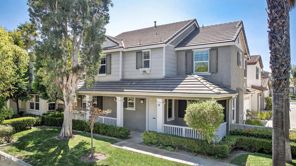 Fantastic opportunity to own at Village at the Park! Located in one of Camarillo's most beloved neighborhoods, and offering over 2,000sf of spacious living space, this 4 bedroom, 2.5 bath home welcomes you with a charming front porch, soaring ceilings, gorgeous laminate flooring, and lovely natural light through multiple windows. The open concept kitchen, complete with granite countertops, updated stainless appliances and large peninsula with counter seating, blends into both the dining and living room with warming fireplace, creating an optimal space to gather with family and friends. A secondary family room located on the opposite wing also features its own fireplace- a perfect place to enjoy morning coffee or a good book. Sliders lead directly out to the landscaped backyard with mature palms & concrete patio where you'll enjoy barbecues, el fresco dining, or quiet moments in the sunshine. On the second level are all four spacious bedrooms, large guest bathroom, and convenient laundry room. Retreat to the primary suite, featuring an expansive walk-in closet, and large ensuite with dual vanity, walk-in shower and separate soaking tub. Plus attached 2-car garage offering ample storage for everyone! Enjoy a multitude of community amenities including parks, pool, spa, sport courts, fitness center, and only minutes to shopping, groceries, top-tier schools, and easy freeway access!
