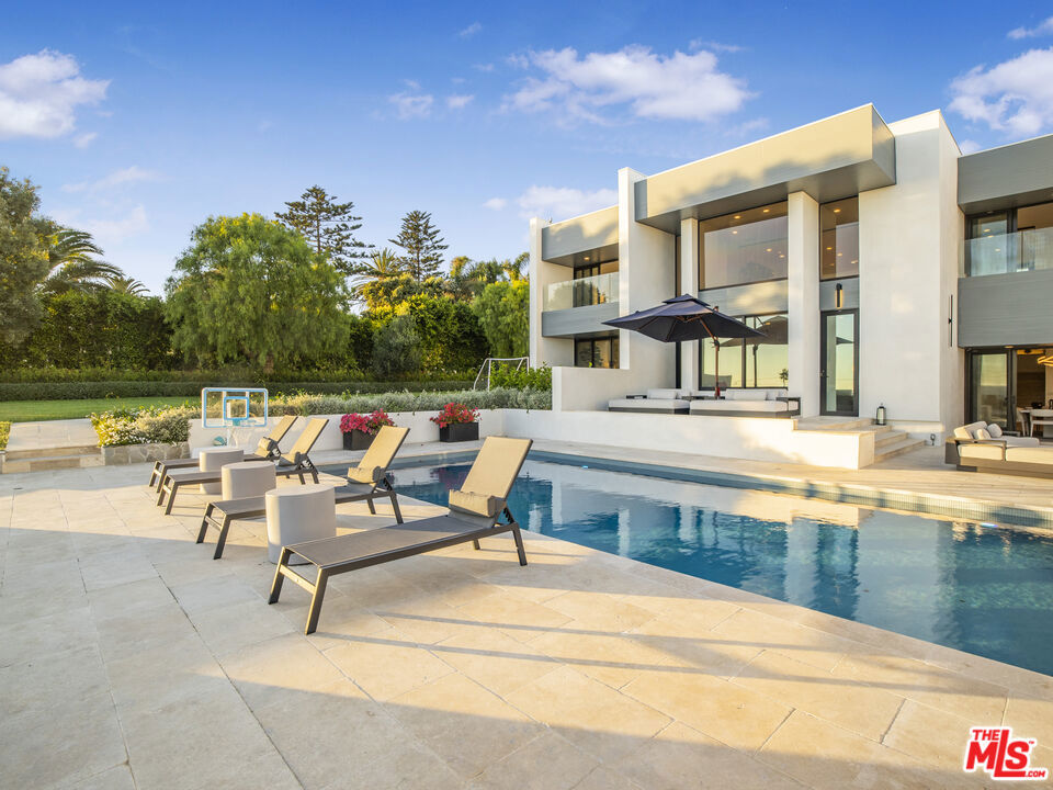 Designed by the renowned Buff & Hensman, this exceptional Malibu estate sits on over an acre of flat blufftop land above Zuma Beach, offering unobstructed panoramic ocean views and dramatic coastal sunsets. Recently fully remodeled and furnished, the home blends iconic modernist design with luxurious contemporary comfort.The entry welcomes you with a serene walkway over a koi pond and into a soaring two-story glass atrium, where 25-foot vaulted ceilings and walls of glass flood the interiors with natural light and frame the Pacific at every turn. Expansive rooms provide a seamless indoor-outdoor flow for entertaining, relaxing, or simply soaking in the tranquil oceanfront setting.Highlights include:Fully remodeled and furnished interiors with designer details throughoutDramatic 25-ft ceilings, glass atrium, and classic Buff & Hensman architectureGourmet kitchen opening to a spacious family room with fireplaceFormal dining room and loft library/study lined with bookshelvesTwo generous primary suites with spa-style bathrooms (one with private garden access)Four additional ocean-view bedrooms, maid's quarters, and multiple entertainment decksOceanfront swimming pool, spa, and expansive grassy lawns with Japanese-inspired gardensPrime Malibu enclave known for celebrity and tech elite neighbors, just moments from beach access, hiking, and PCHThis rare lease opportunity offers a unique blend of privacy, prestige, and architectural pedigreeperfect for extended stays, photoshoots, or as an inspiring coastal retreat.