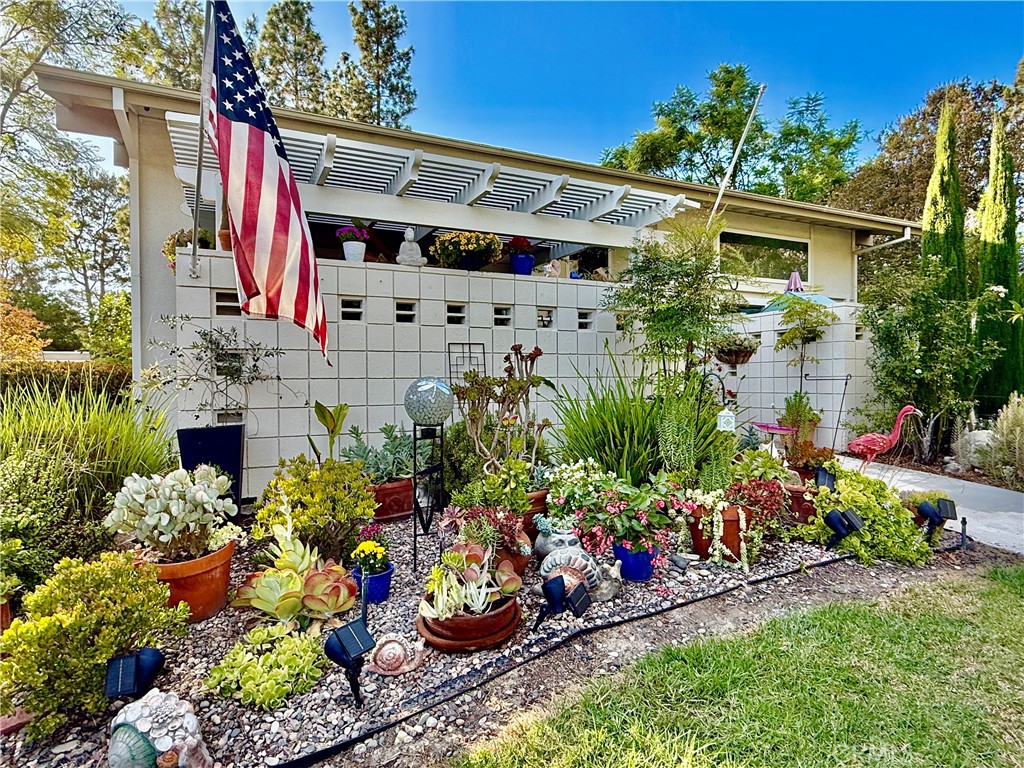 Awesome location! Very close to the CREEK, the most desired location in Laguna Woods! The SEVILLE Model boasts a Cathedral Ceiling which creates the feeling of a real private home and an Inviting, Bright, and Open Airy Living space.
!
The Seville has 2 interior levels, yet it is the ONLY 2 LEVEL model where the MAIN LEVEL has ALL the living space you need, INCLUDING A MAIN BEDROOM AND BATH.
This home has everything! Mini splits air conditioning on both levels, GRANITE countertops, ENGINEERED WOOD FLOORING, custom cabinets, STAINLESS STEEL appliances, including a Brand-New Fridge! Other upgrades include Double-Pane windows, FULL sized Washer and Dryer, Crown molding and recessed lighting, and more.
The BONUS FEATURE of the Seville is the Upper Loft which many use as an office or den overlooking the living area, with a Second Main Bedroom, a French Balcony offering a lovely bright view, a Full Ensuite, and plenty of closets and cabinets.
This great benefit of the second floor is Privacy when guests or family stay over since the BOTH FLOORS have the FULL BEDROOMS and BATHS.
The gorgeous landscaping out front has been meticulously created by a landscape designer and sits in an area of open green space with many trees. Parking is conveniently located very close by!
Less than 5-minute walk to the Creek! Come see this beautiful home! It WON'T LAST!!