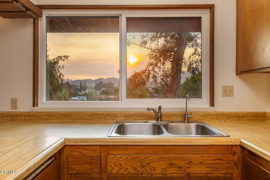 Imagine waking up in your own cozy retreat, surrounded by the serene Ojai mountains and wildlife. This delightful 2-bedroom, 1-bathroom home, perched on just under a half acre lot, captures a whimsical treehouse feel with its elevated charm and lush, private surroundings. Built in 1976 yet freshly renovated in 2025, it's move-in ready! Step inside to a bright, inviting interior that's been thoughtfully updated for modern comfort, a brand new mini splits keep things cozy and efficient year-round, while the recently installed water softener ensures every shower feels luxurious. The open layout flows seamlessly, perfect for cozy nights in or casual gatherings. Outside, the magic really unfolds: this home offers ultimate privacy, like your own peaceful oasis. Fire up the grill on the large deck for sunset barbecues, or tend to your feathered friends in the chicken coop. There's dedicated RV parking as well as a two-car garage, which has the potential to become a junior ADU, offering extra space for guests, a home office, or even rental income down the line. With an easy commute to Los Angeles or Santa Barbara, you get the best of small town tranquility and big-city access. Whether you're starting a garden on your half-acre haven or simply soaking in the treehouse like views, this property invites you to embrace a simpler, more joyful way of life.