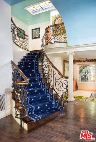 Nothing says Old Hollywood quite like this home. A seven bed, seven bath, classic Tudor in the flats of Beverly Hills. Once owned by the great Shirley Temple. And most recently home to the beloved actress Renee Taylor and her husband Joe Bologna.Conveniently placed between Beverly Hills shopping, The Beverly Hills Hotel, and the Sunset Strip. On a tree-lined street boasting some of Los Angeles' most beautiful and notorious homes.The property greets you with it's mature trees and romantic story book exterior. A fountain tucked into the greenery on your right as enter you enter the home's foyer, once tread by Hollywood royalty. Light filtering through the leaded glass windows makes for an enchanting ambiance through-out the first floor, while you explore the home's kitchen, wood paneled family room, two downstairs bedrooms, and secret passageways.Upstairs you will find a sprawling master suite, and two more bedrooms overlooking the backyard gardens with ample closet space throughout.