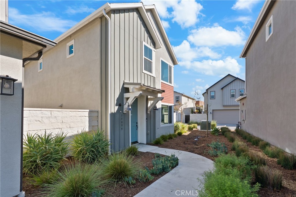 Now available for lease, 27004 Trail View Lane offers the perfect blend of modern comfort and vibrant community living in the heart of FivePoint Valencia. This beautifully designed, fully detached home features a spacious open-concept layout ideal for both everyday living and entertaining. The kitchen is equipped with quartz countertops, shaker cabinetry, a farmhouse sink, and a reverse osmosis water system. The bright and inviting living spaces flow seamlessly throughout, creating a warm and welcoming atmosphere. The primary suite includes a private ensuite bathroom with dual sinks and a large walk-in closet, providing the perfect retreat.
Additional features include an attached two-car garage and owned solar panels, which are included with the rent to help offset monthly electricity costs. Kitchen refrigerator, washer and dryer are also included. Residents will enjoy direct access to Confluence Park, offering resort-style amenities such as three geothermal pools, cabanas, a clubhouse, playgrounds, and miles of scenic walking trails. Conveniently located near top-rated schools, Six Flags Magic Mountain, shopping, dining, and easy access to the I-5 freeway, this home is the ideal opportunity to experience the best of Valencia living.