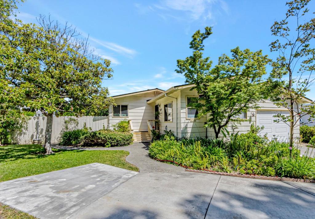 This quiet hillside home features a spacious open floor plan and a generous primary bedroom. Offering 2 bedrooms and 2 bathrooms, it includes double-pane windows and skylights that fill the space with natural light. Enjoy the large, beautifully landscaped yard and a spacious wood deck perfect for gardening or entertaining. The property also includes a 1-car garage and a private parking space for an additional vehicle, making it truly one of a kind. Nestled against the hills, this home provides both scenic views and added privacy. Its located in the highly desirable Mountain Springs Mobile Home Community, a senior park where at least one resident must be 55+ and others must be at least 18. Buyer must be approved by the park once under contract. Monthly space rent is $1,363.90.