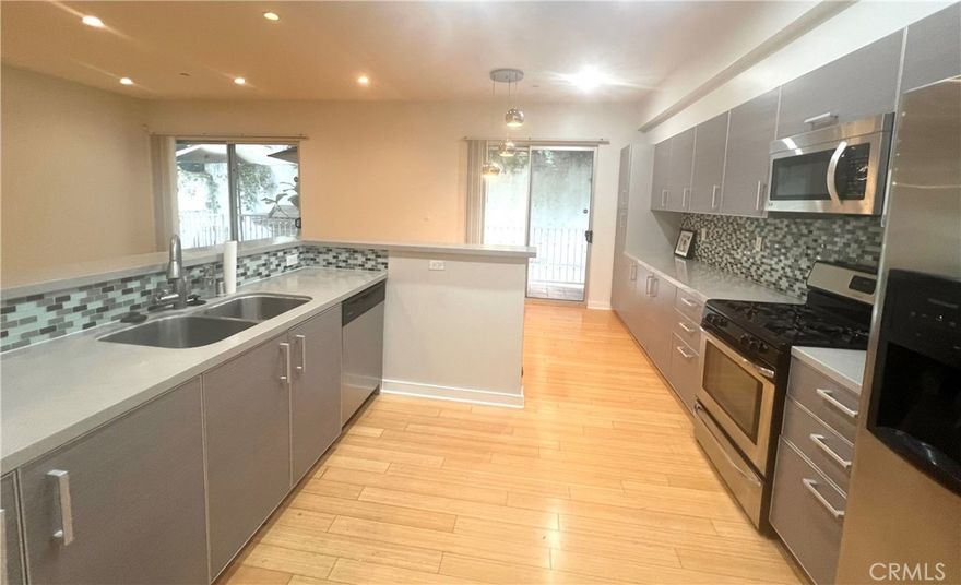Beautiful end unit of condo complex with excellent condition! Very bright and airy inside! It's like 2 large master bedrooms with it's own bathrooms and one extra bathroom for guests. Great area in Korea Town! Very convenient location for all shopping and markets!!! High quality hardwood flooring through out. Beautiful kitchen with island and recessed lights. Electric fire place in living room Extra wide hallway makes you comfortable and safe. Recreation room that you can use like your own is right next door. Refrigerator, stacked washer & dryer are included. Please view a Virtual Tour below for more details.