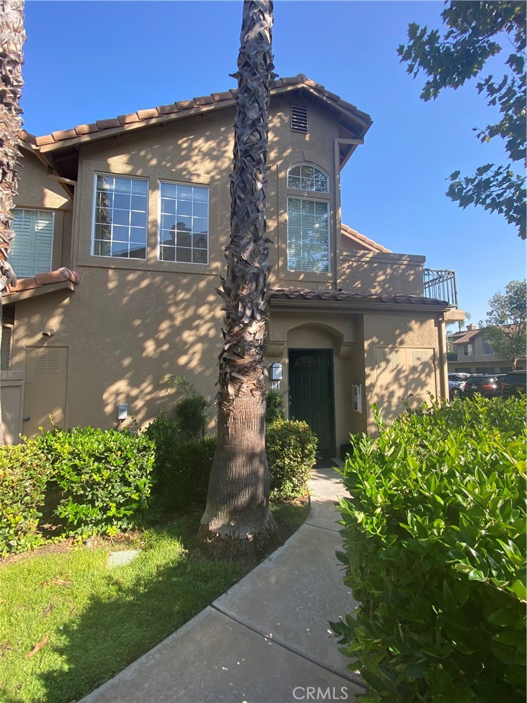 Desirable upper-level End unit in the Calabria Community. Light and Bright interior with carpet throughout the well-designed floor plan. The main living area has high vaulted ceilings, numerous windows, a romantic fireplace, and a dining area with direct access to the large private patio. The kitchen features updated stainless steel appliances, multiple countertop spaces, recessed lighting, and a breakfast bar, and is open to the main living areas. The Primary suite is a private retreat with vaulted ceilings,e master bath with dual vanities, and a walk-in closet. The 2nd bedroom has high ceilings, mirrored closet doors, and there is a full guest bathroom. 1 car direct access garage with full-size washer & dryer hookup. Great location, walking paths with amenities. Community pool, spa, plenty of guest parking, and all the fantastic amenities Aliso Viejo Community Association has to offer, including numerous parks, community events, and award-winning schools. Walking distance to Aliso Viejo Town Center with lots of shopping choices, dining, theaters, and entertainment, and close to the local Library and Aliso Viejo Ice Palace and Ice Skating.Minutes from beaches and shopping areas.
