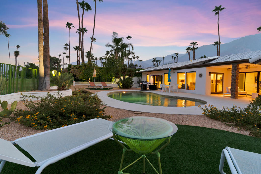 Nestled on an expansive, low-maintenance desert-landscaped lot in the coveted Indian Canyons neighborhood, this home captures spectacular east and west vistas--from the dramatic San Jacinto Mountains to the west to the wide-open fairway views of holes one and two and the Murray Canyons to the east. Over the years, the property has seen significant upgrades (please refer to the attached FAQ sheet for details). A secured, gated entrance welcomes you into a private front courtyard. Inside, a custom glass front door opens to a formal entry, offering a stunning first impression to all who visit. Stylishly appointed and tastefully furnished, this home is being sold turnkey, ready for immediate enjoyment. Designed with effortless flow, the open-concept layout features a spacious living and dining area. The living room showcases a generous gas fireplace, direct access to the gated courtyard, and breathtaking views in both directions. The kitchen is equipped with granite countertops, stainless steel appliances, an island, and convenient access to the sunny breakfast nook. The first of two primary suites occupies the south wing of the home and enjoys soaring vaulted ceilings, abundant natural light, panoramic backyard and golf course views, and a walk-in closet. The en-suite bath offers a large tiled shower, dual vanities, and additional fairway views. The second primary suite is situated on the north side, complete with recessed lighting, a built-in sound system, and direct access to the covered patio and backyard. This exceptional property is offered fully furnished--just bring your toothbrush and start living the Indian Canyons lifestyle. No HOA dues!