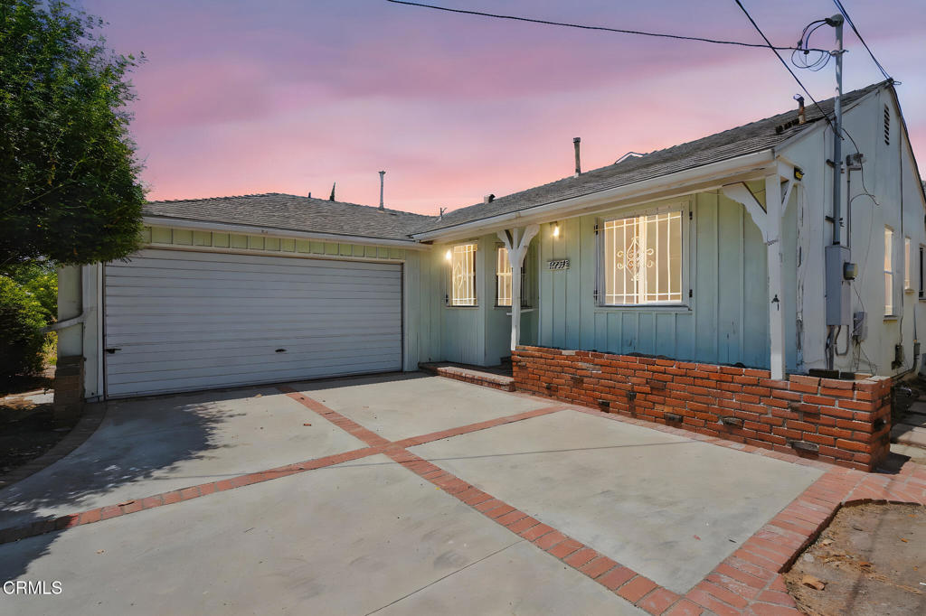 Discover this timeless Van Nuys charmer that offers a perfect blend of classic warmth with modern opportunity! Step into a world of mid-century appeal with original hardwood floors and a bright, well-proportioned layout. The generous living area flows seamlessly to a yard lush with fruit trees and drought-friendly landscaping--an entertainer's delight. A private rear entrance unlocks creative potential: transform into an ADU, guest suite, or home office. Conveniently located within walking distance of shops, restaurants, schools, and medical facilities, this 3 bed, 2 bath home offers a harmonious balance of classic character and future-ready opportunity.