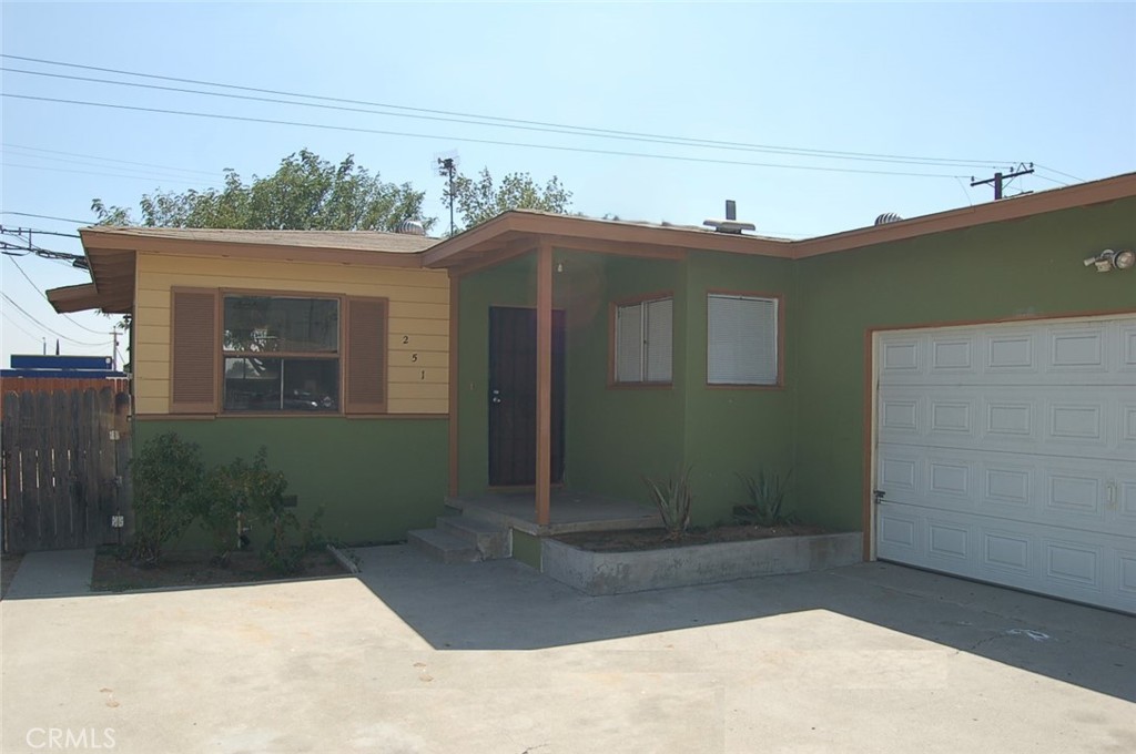 Welcome to this well-maintained single-level home, ideally situated close to schools, shopping, and with convenient commuter access. Inside, you'll find a bright open floor plan featuring a spacious living room with attractive wood laminate flooring and fresh paint throughout. The kitchen offers ample cabinet and counter space, along with a cozy dining nook perfect for casual dining. This home includes three generously sized bedrooms and one well-appointed bathroom. Step outside to enjoy a private, nicely sized lot complete with gated RV parking—ideal for extra vehicles or recreational use. A two-car attached garage offers direct interior access, adding everyday convenience to this inviting home.