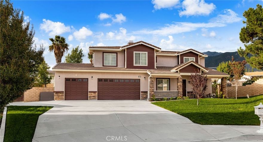 This beautiful executive home is nestled on a huge 12,097 square foot cul-de-sac lot in one of Rancho Cucamonga's most sought after neighborhoods and as soon as you lay your eyes on it you'll recognize the owners true "Pride-in-ownership" here are just a few of its many other outstanding features: + Its lush landscaping, complementary, paint scheme, and stacked stone portico entry with white picket fencing enhance its eye-catching curb appeal + You'll step into a flowing 3,095 square foot open concept floor plan that is in "Move-In-Condition" with recessed lighting, a designer paint scheme, plantation shutters, and an aesthetic blend of laminate and tile flooring • The spacious living room is bathed in natural light from a multitude of windows • The family's cook is going to truly appreciate the kitchen's abundant cabinets, ample granite counters, large center island with built in breakfast bar, durable dual basin stainless steel sink with custom faucet, built-in stainless steel appliances, sit down breakfast area with its direct backyard access, and the convenice of the adjacent formal dining area + Since the huge family room with its cozy gas-burning fireplace flows seamlessly with the kitchen you'll find it very easy to serve and entertain your guests simultaneously + A total of 6 bedrooms + The huge grand suite has an open sitting area, very large walk-in closet with built in organizers, plus a sumptuously appointed bathroom with huge mirrored dual sink vanity, soothing spa tub, glass enclosed shower and private commode + 3 bathrooms; 1 is located on the first level for your guests Functionally located laundry room with abundant storage, and handy vanity with sink + The energy efficient dual pane windows and gigantic solar panel array will help keep your utility bills low • Central air & heat for year-round comfort + You're going to enjoy the huge backyard that can easily accomodate any lifestyle addition • Plenty of secure off street parking for all of your vehicles and other toys on the oversized concrete driveway and in the 3 car direct access garage • Great location close to schools, Chaffey College, grocery stores, parks, the Colonies Crossroads Mall, and the 15 & 210 freeways + Call now for all the details and I'll gladly arrange a private tour.