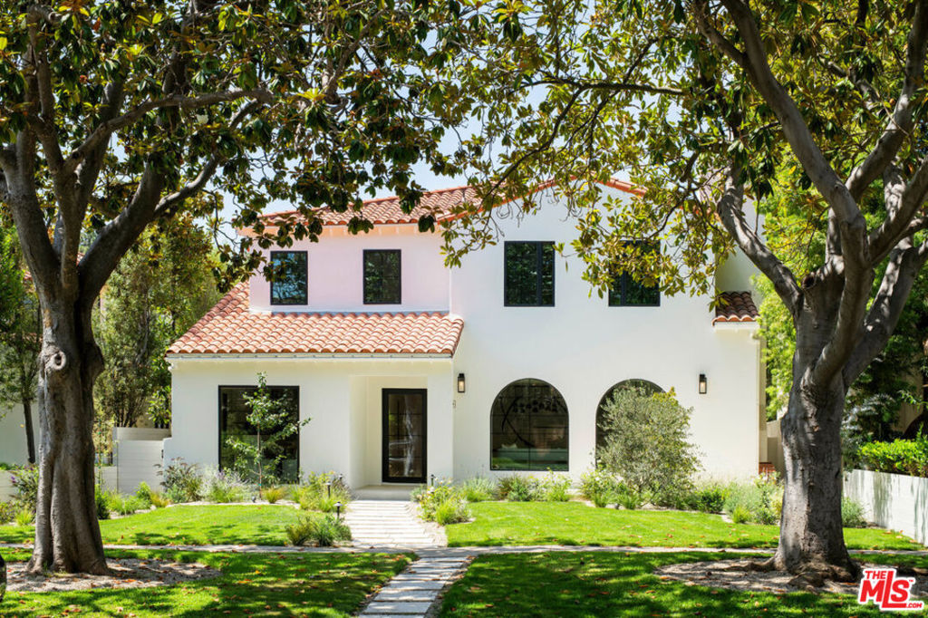 Sophisticated, modern Spanish abode situated in the coveted North of Montana neighborhood. Artfully integrating indoor-outdoor living, this exquisitely updated open-concept residence spans 3,796 SF while boasting 6 bedrooms, 5 bathrooms, and a myriad of outdoor living space on a 7,512 SF Lot. Grandiose arched windows allow for natural light to pour in the living room with a gorgeous Spanish-style fireplace offering the perfect space for gathering with friends and family. An oversized formal dining room and cozy niche are located just off the gourmet kitchen featuring premier elements including a Miele induction stovetop, double ovens, wine fridge, custom cabinetry and walk-in pantry. Enjoy breakfasts in front of a picture window overlooking the gorgeous Mediterranean-inspired front yard. An ensuite guest bedroom as well as an additional secondary bedroom/office opens onto a covered porch and expansive patio. Outside, a sprawling lush landscape sets the mood for alfresco entertaining complete with a built-in BBQ, pizza oven and refrigerator. On the second level, step into the spacious and serene primary suite with a lovely alcove and tranquil fireplace. The spa-like bathroom welcomes you with dual vanities and a spacious shower and soaking tub. With a natural, earthy palette, the perfectly curated walk-in closet offers custom built-in shelving and drawers. Another ensuite bedroom with tub and shower as well as two additional secondary bedrooms adorn the second floor with a landing serving as a second living or homework area with the laundry space conveniently located nearby. Additional features include a two-car garage with alley access, electric vehicle charging and multi-zone heating/air. Situated in the sought-after Franklin Elementary School vicinity with easy access to the best of Montana Avenue's distinctive shops and dining!
