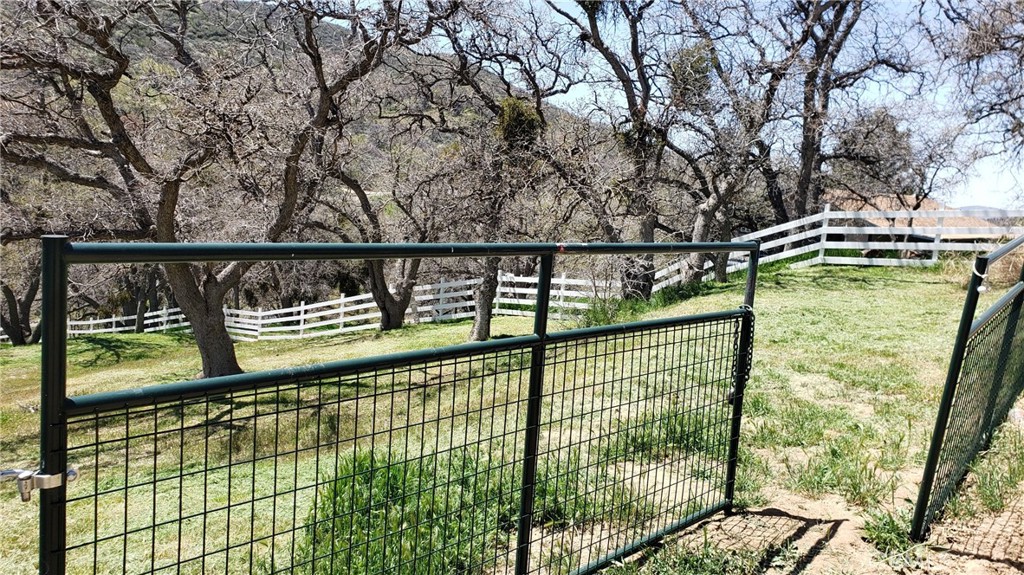 Built your dream house on this beautiful lot with view of the mountains. The lot is on a street with water, electricity nearby. Great neighborhood with nice homes around. Bring us your offer! Survey is done and there are about 6 post on each side of the property. Lot has been fenced
and has a gate.