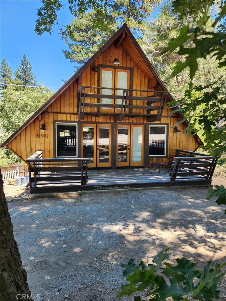 Beautiful cabin home available in Running Springs. Double pane windows, newly installed energy efficient tankless water heater, roof less than ten years old, plenty of flat parking with RV parking in front, income potential with lower outside access studio apartment. Located next to National Forest with immediate access to walking trails, walking distance to market, half a mile to town and restaurants, less than five miles to Snow Valley.