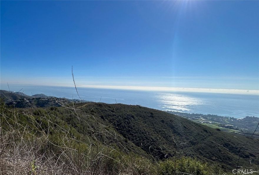 Promontory with 360 ocean, mountain, and canyon views. Panoramic ocean views from Palos Verdes, to Catalina to, Pt Dume to Anacapa. Nothing compares at this price.  Easy access from Kanan Rd or Latigo Canyon. LVMWD water is at the property line. Overhead power is close by.  Rarely does a site with this kind of view come along. Lots of usable space for estate home, tennis court, horse stables.  Seller will provide attractive financing with a large down payment.
