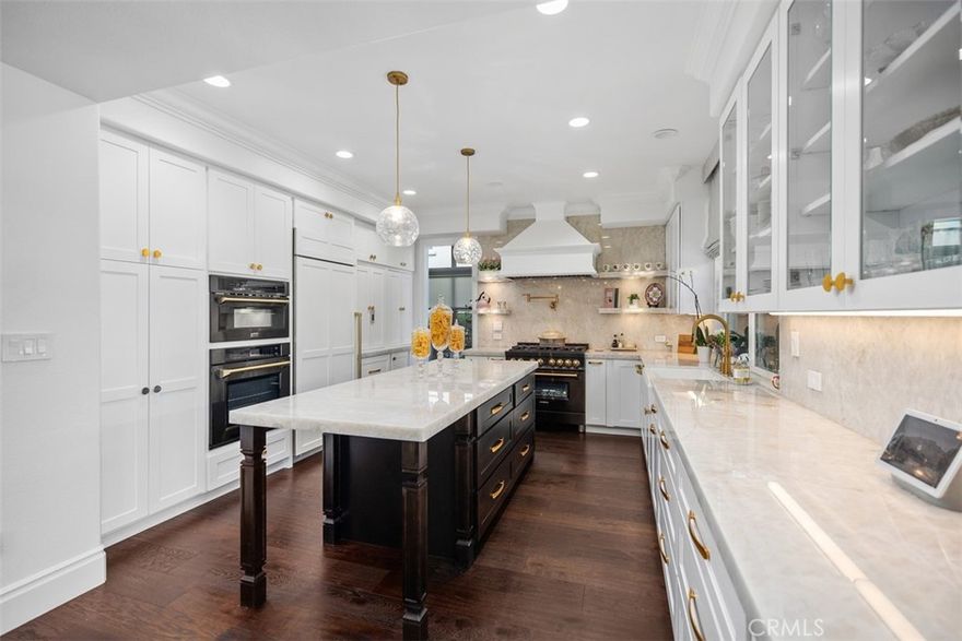 Remodeled Turn-Key Home Situated on the Golf Course! This stunning home welcomes you with impressive soaring ceilings, newer hardwood flooring, and Significant Upgrades including a whole-house repipe, fresh interior and exterior paint, remodeled kitchen, remodeled bathrooms, and more! Step into the remodeled chef's kitchen, a true masterpiece featuring luxurious crystal quartzite countertops and newer cabinetry. Enjoy a custom bar with elegant backlit quartzite. Flowing seamlessly from the kitchen is the comfortable family room with a limestone fireplace – perfect for relaxing evenings. The formal living and dining rooms feature soaring ceilings and Picturesque Views of the backyard, complete with a tranquil waterfall, a refreshing Pool, and the scenic Golf Course. A convenient main-level bedroom includes a private ensuite bathroom. Upstairs, the primary suite offers a balcony with panoramic golf course views, a fireplace, and a beautifully Remodeled Primary Bathroom with marble and a luxurious soaking tub. The well-appointed secondary bedrooms provide ample closet space, and all bathrooms have been thoughtfully remodeled with modern finishes. Step outside into your private resort. The backyard is an oasis, featuring a sparkling pool, a newer island, a cozy fireplace, a built-in BBQ for effortless entertaining, and a pizza oven. This exceptional home also includes the convenience of a 3-car garage. Located within a prestigious 24-hour guard-gated community, and as a resident of Dove Canyon, you’ll enjoy access to a Jr. Olympic pool, tennis courts, pickleball court, sport court, playground, and scenic trails with access to hiking, biking and horse trails. You will also have the option to join Dove Canyon Golf Club, a Jack Nicklaus Signature design with dining, wine room, gym and more.