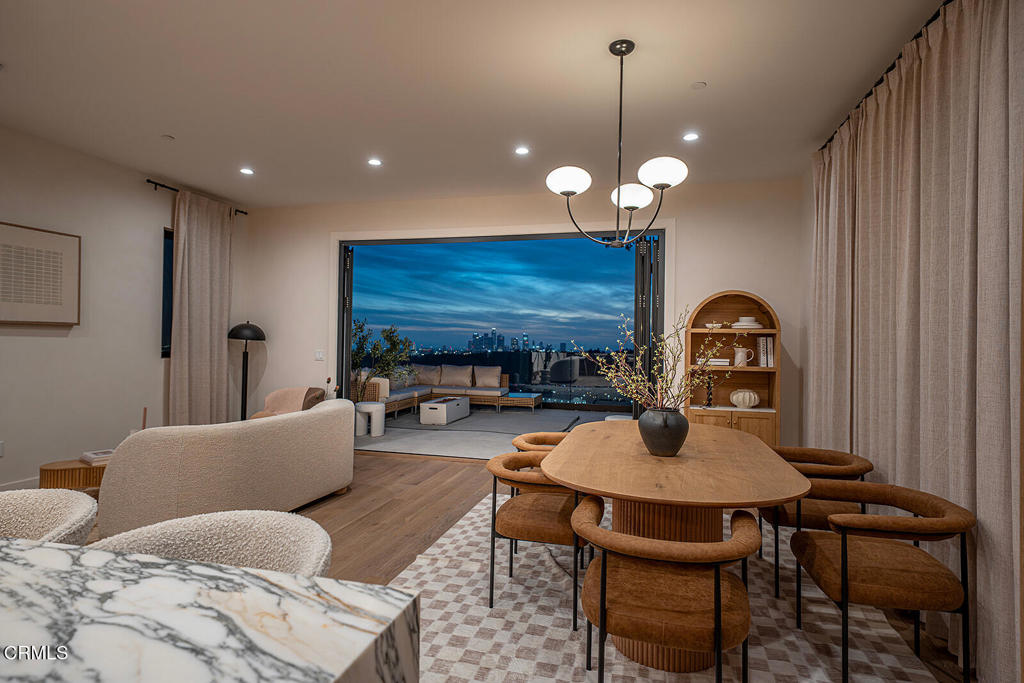 Perched high on Mount Washingtons coveted Kite Hill, this newly built contemporary home combines striking design with breathtaking views. Spanning 2,160 square feet, the residence offers 3 bedrooms and 2.5 bathrooms, each space crafted for comfort and style.From sunrise to sunset, enjoy unobstructed panoramas of Downtown LA, Griffith Observatory, and Dodger Stadium through expansive windows that flood the home with natural light. The open floor plan is elevated by a soothing palette of soft whites, warm earth tones, and natural wood finishes, creating a calm and airy atmosphere throughout.The chefs kitchen is a showpiece with custom cabinetry, polished stone counters, and high-end appliances, perfect for both everyday meals and entertaining. The primary suite feels like a private retreat with balcony access, a spa-inspired en-suite bath, and designer finishes. Two additional bedrooms offer relaxed elegance for family or guests.Designed with sustainability in mind, the home features paid-off solar panels for energy efficiency. Outdoor living is equally impressive, with two levels of decks and terraces that make the most of Los Angeles skyline and hillside tranquility.Living in Mount Washington means the best of both worlds: quiet trails, nature, and a close-knit community, all just minutes from the citys vibrant core and the award-winning Mount Washington Elementary School.This home is a rare blend of modern luxury and natural beauty a place where hillside serenity meets the energy of Los Angeles.