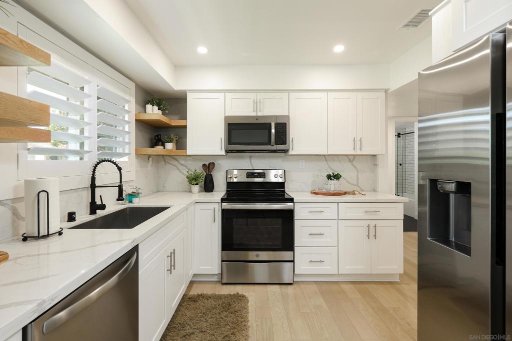 Welcome to 3660 Vista Campana N #15 – a beautifully remodeled single-level home located in the highly desirable 55+ community of Oceana. This move-in ready 2 bed, 2 bath gem boasts a brand-new roof and central A/C, offering comfort and efficiency year-round. Step inside to a bright and open floor plan filled with natural light, custom shutters, and upgraded finishes throughout. The remodeled kitchen features modern cabinetry, quartz countertops, and stainless steel appliances, while both bathrooms have been thoughtfully updated with upgraded toilets, sleek fixtures, and tile work. Enjoy the convenience of automatic skylight blinds, custom shelving in the closets, and tranquil greenbelt views. Just steps from the golf course, the location offers both peaceful surroundings and easy access to recreation. The HOA includes a wide range of amenities such as a pool, spa, clubhouse, and RV parking—plus water, trash, cable, landscaping, and more. *Discounted interest rate available. Contact Listing Agent for more details.* Don’t miss this rare opportunity to own a fully upgraded home in one of Oceanside’s most established communities!