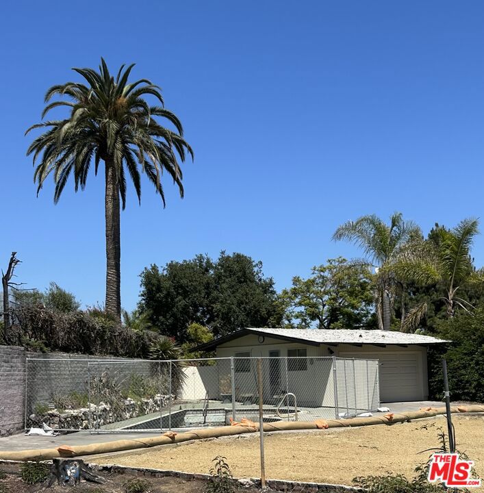 Rare Opportunity in Marquez Knolls! Nestled at the end of a charming cul-de-sac in the coveted Marquez Knolls neighborhood, this expansive lot offers a unique opportunity to rebuild in one of Pacific Palisades' most desirable locations. The former home, lost in the Palisades fire, was a 2,118 sq ft residence offering a foundation for your dream home with potential for expanded square footage.Enjoy peaceful evenings under the stars, cool ocean breezes, and peek-a-boo ocean views from this serene setting. Just minutes from the Palisades Village, scenic hiking trails, and the beach, this lot combines tranquility with convenience. Whether you're an investor, builder, or future homeowner, this is your chance to create something truly special in a prime coastal community. Garage is still standing but has not been fully evaluated for damage. CC&Rs apply, look at Zimas.org for zoning information. Neither Seller nor Broker/Agents guarantee the accuracy of the square footage, lot size, permits or other information concerning the conditions or features of the property. Buyer is advised to independently verify the accuracy of all information (including square footage) through personal inspections and with the appropriate professionals.