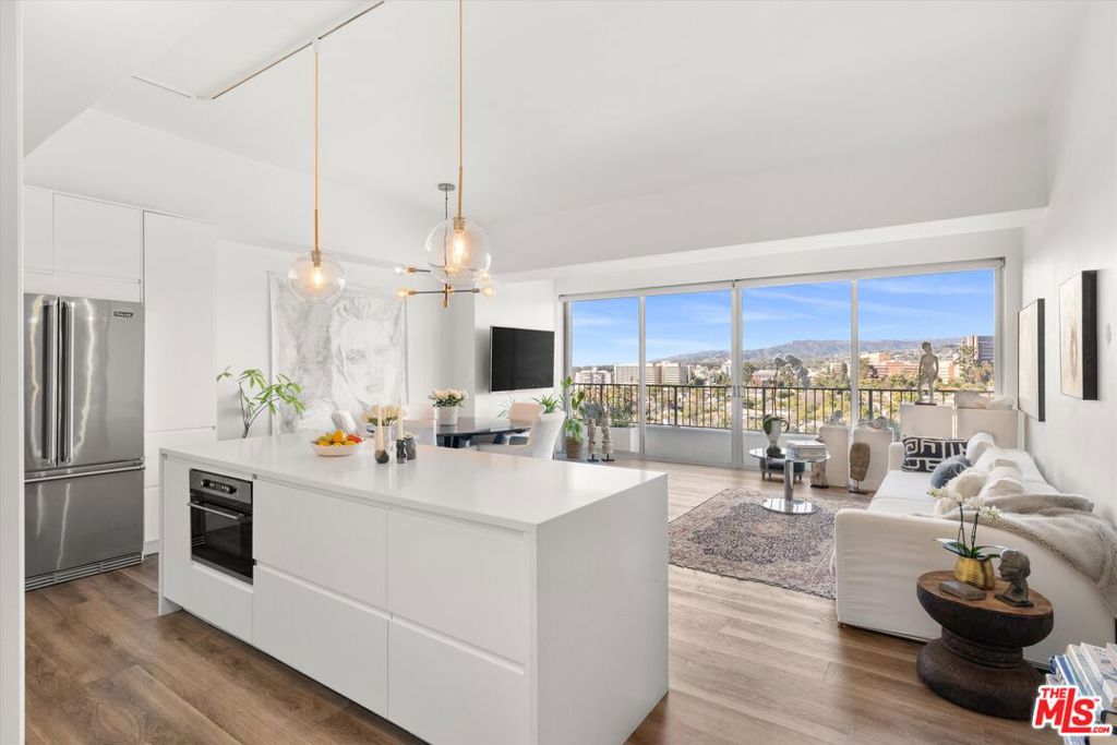 Move right in and enjoy this beautifully renovated residence at the prestigious full-service Wilshire Regent, offering a true turnkey lifestyle. Every room showcases breathtaking, unobstructed views stretching across Holmby Hills and beyond. The open floor plan is designed for effortless living, with dramatic floor-to-ceiling sliding glass doors and soaring ceilings that flood the home with natural light. A showpiece chef's kitchen, complete with quartz countertops, a generous island, and top-of-the-line stainless-steel appliances, makes cooking and entertaining a delight.The tranquil primary suite boasts abundant closet space and a spa-inspired bath, while the second bedroom is ideal for guests or a private home office. Wide-plank floors throughout add warmth and sophistication to the modern design.At the Wilshire Regent, every detail of luxury living is at your fingertips24-hour concierge and valet, sparkling pool, sun deck, fitness center, guest suites, and on-site management. Perfectly located near UCLA, Century City, and Beverly Hills, this home is delivered unfurnished and ready for immediate enjoyment (photos show it furnished). All utilities are included (except premium cable channels), with two washer/dryers conveniently located on the floor. Shown by appointment with 24 hours' notice. ASKING PRICE IS COMPLIANT SINCE THE EXITING TENANT WAS PAYING WITHIN THE 10% GUIDELINE.