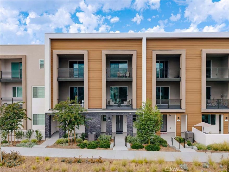Situated in the highly desirable Great Park Neighborhoods of Irvine, this elegant Solis Park residence not only showcases the perfect blend of modern design and timeless comfort but also boasts a premier location within walking distance to Portola High School, one of Irvine’s most acclaimed schools recognized for academic excellence and college preparation. With inviting curb appeal and a thoughtfully designed floor plan, the home opens to an expansive great room that connects seamlessly with the gourmet kitchen and dining area, creating an effortless flow ideal for relaxed family living and sophisticated entertaining. The chef-inspired kitchen is appointed with premium finishes, sleek cabinetry, a large center island, and stainless steel appliances, combining functionality with style. The primary suite serves as a luxurious private retreat with spa-like bath, dual vanities, soaking tub, and an oversized walk-in closet, while additional bedrooms provide versatility for guests, an office, or creative use. Expansive windows fill the home with natural light, and sliding doors extend the living space to the outdoor patio for true California indoor-outdoor living. Residents of Solis Park enjoy award-winning Irvine schools, including Solis Park K–8 and Portola High, plus exclusive resort-style amenities such as pools, clubhouses, parks, playgrounds, and scenic trails, all within minutes of shopping, dining, and major freeways.