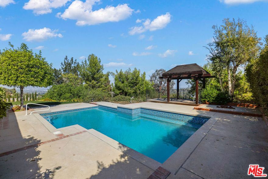 Unbelievable Price for this Stunning and Sophisticated Midcentury pool home with amazing 200+ degree views situated on sprawling grounds in verdant hillside setting. Completely remodeled by owner for owner. The home has the luxurious interior polish of a modern home.  The turnkey 4 bedroom 3 bath residence with private, fenced yard is graced by a magical pastoral surround and stunning valley and mountain views. Features include a cook's kitchen with brand new appliances, Dolby surround system, vaulted ceilings, and impeccable style. The open plan public rooms and the spacious primary suite have jetliner views and play to the resort-like backyard creating a smooth transition between indoor and outdoor living. Replete with remodeled, heated pool with pebble and glass tile, deck and trellis, expansive flat grass, turf area and breathtaking views. The space is ideal for recreation or relaxation. Attention to detail, and idyllic surround set this home apart. This turnkey showcase is one of a kind in a private setting south of the boulevard.