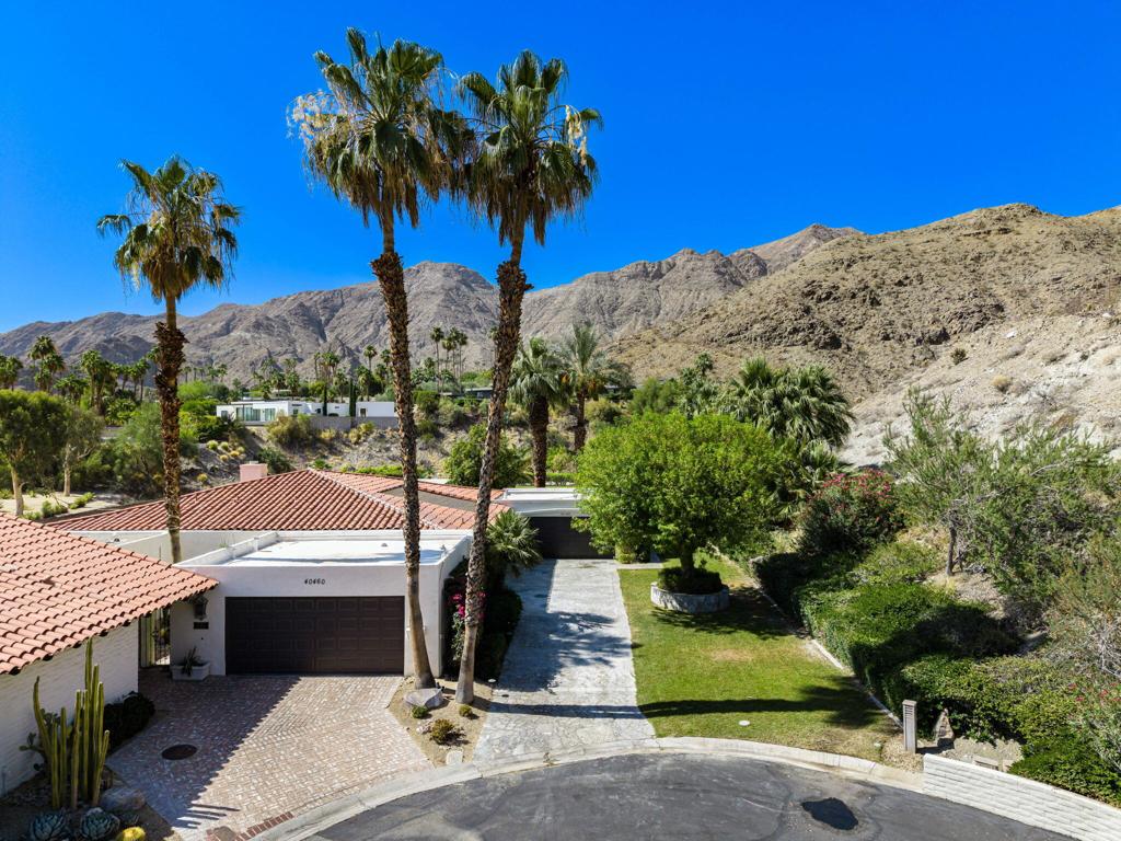 Top of the hill in Thunderbird Villas. Nestled on a generous lot with a truly one of a kind backyard. This home offers the ultimate in privacy and comfort. The spacious layout includes four bedrooms and four bathrooms, open beam ceilings, fireplace and built-in shelving throughout. Enjoy true desert living with a private backyard oasis complete with a covered patio, fire pit, and your private pool and spa