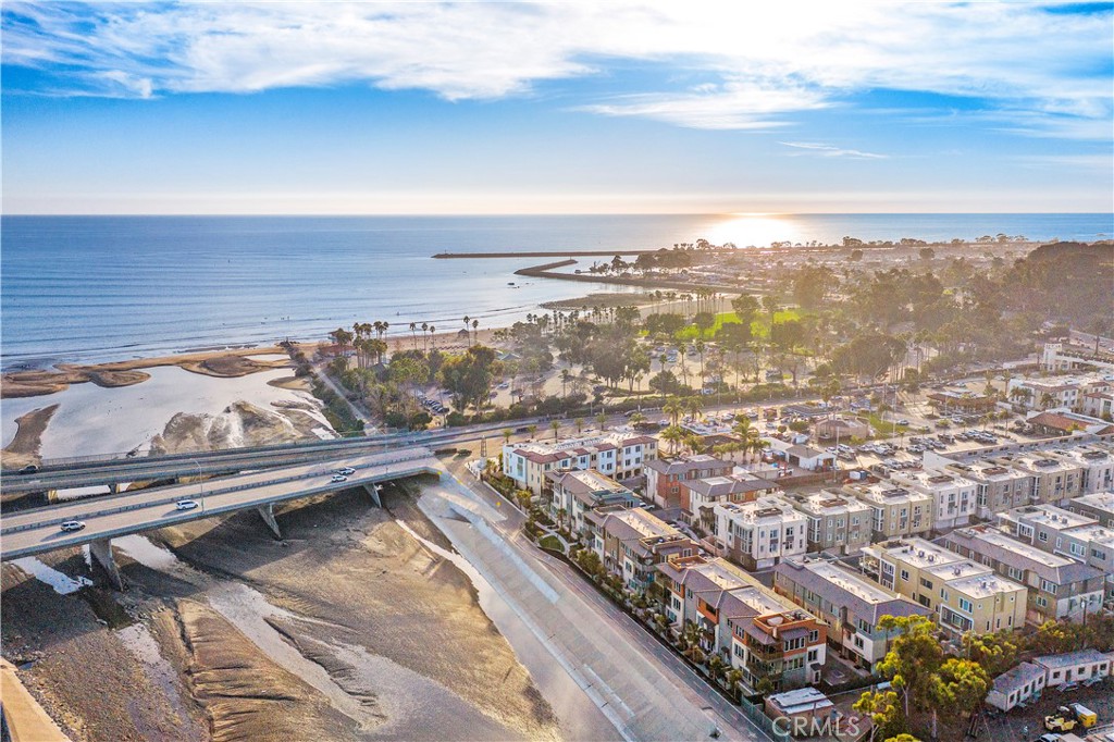 South Cove luxury townhome with whitewater ocean views and just steps to the beach! You're sure to enjoy this one-level home that is situated on the top floor optimizing views and sunshine! This spectacular, East-facing floorplan has three-bedrooms and includes an ocean view balcony, panoramic views from the rooftop deck, a dumbwaiter for convenience, plus a 3-car garage and 50 AMP EV charger. Upgrades include shutters, murphy bed, water softener, tankless water heater, thick edge quartz countertops, newer appliances, soft closing cabinets with oversized pot drawers, wide plank flooring and much more! Located just off Pacific Coast Highway in South Orange County within walking distance to numerous coastal amenities throughout Dana Point. South Cove is beach close and includes a community pool and spa. Walk or bike to Doheny Beach, Ohana and Jazz Festivals, newly renovated Dana Point Harbor (with tons more to come!!), or head north to old town San Juan Capistrano via the San Juan Creek trail. Close to 3 world-class resorts, parks, coastal trails, beaches, dining and shopping at the Lantern District. Don't miss the floorplan posted at supplements.