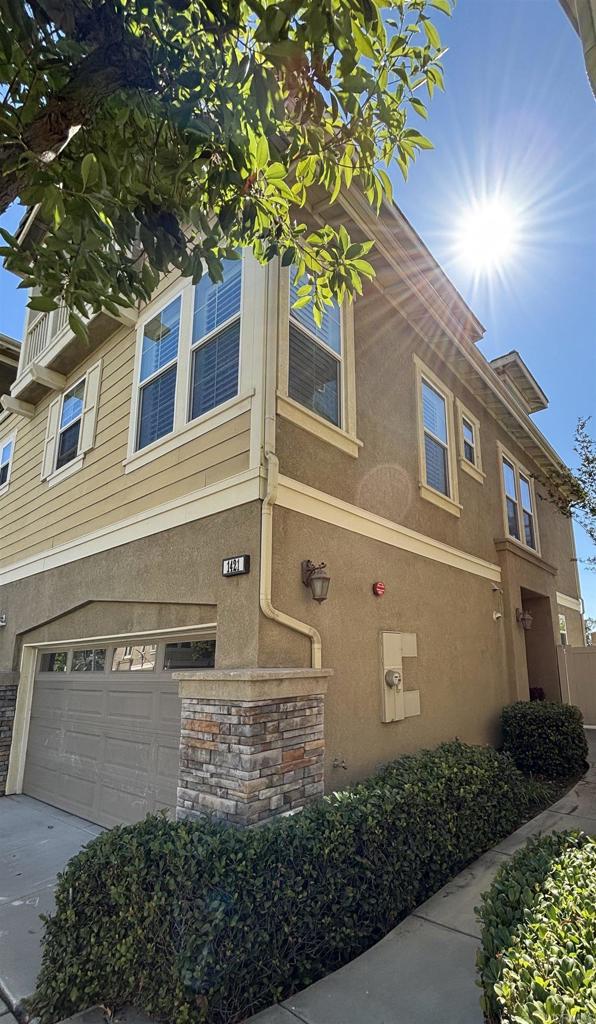 Located in the desirable, family-friendly University Heights community, this spacious single-family attached home (built in 2007) offers 3 bedrooms, each with its own full bathroom, plus a guest powder room. The top floor features the primary suite and a secondary bedroom, while the main level boasts a bright living room with hilltop views, wood flooring, and a well-appointed kitchen with granite countertops, stainless steel appliances, and a generous dining area. The ground floor includes a private bedroom with an en-suite bath and direct access to the attached 2-car garage. Plantation shutters throughout add a touch of elegance. Enjoy community amenities including a pool and nearby walking trails. Conveniently located near award-winning Beechwood School (K–8), downtown Fullerton, shopping, and dining. No Mello-Roos. HOA covers community pool, and front yard maintenance. No pets permitted. Assistance animals will be reasonably accommodated in compliance with all applicable laws. All applicants must apply online. Contact Listing Agent for application instructions.