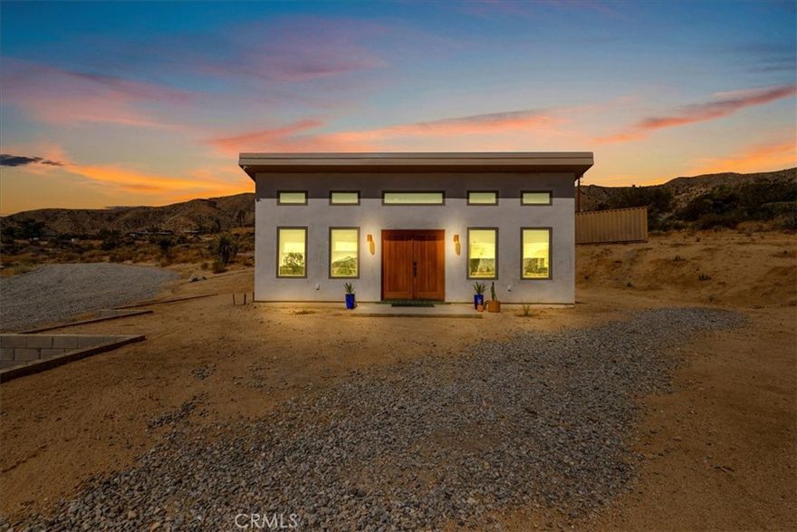 Wake up to stunning desert sunrises, sip coffee on your front patio, and spend your days exploring trails right outside of your door! Whether you’re here for a weekend retreat or a longer stay, this brand-new (2023) 600 sq ft modern build set on corner acreage is the perfect desert getaway. Inside, you’ll find an open floor plan featuring polished concrete floors, a bright and airy living space with every window framing views, and a spa-like bathroom with porcelain tile and a soaking tub/shower combo—the ideal spot to unwind at the end of the day. Every detail was designed for comfort: thermally efficient windows and doors, solid wood entry and interior doors, SIP construction that offers great insulation (R-42 roof/R-26 walls), and three ductless mini-splits to keep each space perfectly cool or cozy. This is an all-electric, solar-powered home, so you can enjoy modern comforts while living lightly on the land. You’ll love the cowboy pool, perfect for cooling off while soaking in the 360° panoramic mountain views after a day full of desert exploration. For practical needs, there’s also a shipping container on-site, giving you plenty of storage space for gear, tools, or toys. The property itself is designed with the future in mind—there’s an upgraded water meter and oversized septic system big enough for another, larger single-family home, and the site has already been graded for the next build. The location? Couldn’t be better. Set in one of the most desirable areas of Morongo Valley with epic views of Mt. San Jacinto, you’re less than 1/2 hr away from Palm Springs and Joshua Tree National Park, while being just minutes from local favorites like Cactus Mart, Spaghetti Western, Coyote Cone, and Farmer in the Dale. Plus, you’ll be close to hiking and horse trails, with Sand to Snow National Monument and Big Morongo Canyon Preserve practically in your backyard.

Whether you’re looking for a primary home, a short-term rental, or a long-term investment property, this little desert gem is a stylish, comfortable base for it all!