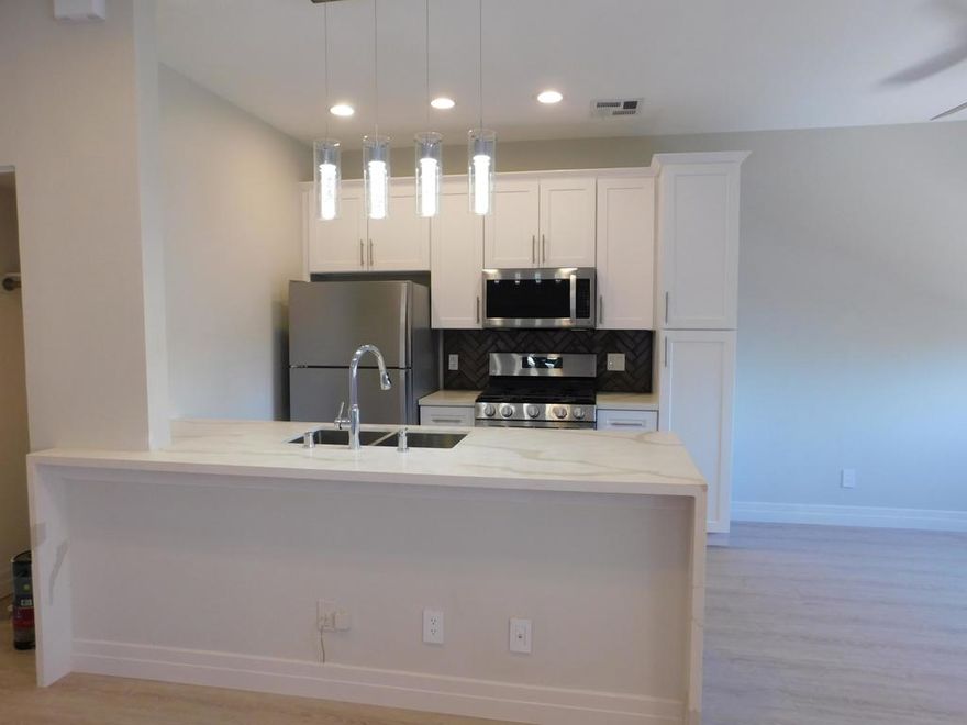 WOW! LUXURIOUS 2 bedroom, 2 bath has been completely remodeled from top to bottom!  No expense  has been spared in this stunning unit!  You'll be impressed with the gourmet kitchen!  Sleek quartz kitchen countertops pleases the eye! Top of the line stainless steel appliances includes a 5 burner GAS stove, dishwasher, Microwave, + the Refrigerator is included!  You will love the soft close Shaker style cabinets and drawers!  High quality gage stainless steel sink with grates,  stylish faucet, modern hanging light fixtures, glass backsplash and more!  Wait until you see the bathrooms! The Micro Glaze, dual flush toilets are super easy to clean!  High end glass shower doors open to your 2 lavish showers and tub.   Waterproof flooring and baseboards throughout! NO carpets that cause allergies!  Both bedrooms have mirrored closet doors. Must have INDOOR, large capacity Washer/Dryer! Even the HVAC system is new!Relax in your balcony and enjoy the evening sunsets and cool breezes! Community Pool nearby. Centrally located in Thousand Oaks, close to freeways, Civic Arts Plaza, The Lakes, Gardens of the World, Oaks Mall and favorite grocery stores!   Don't lose out on this highly upgraded 2 +2 on the 2nd floor with a view!