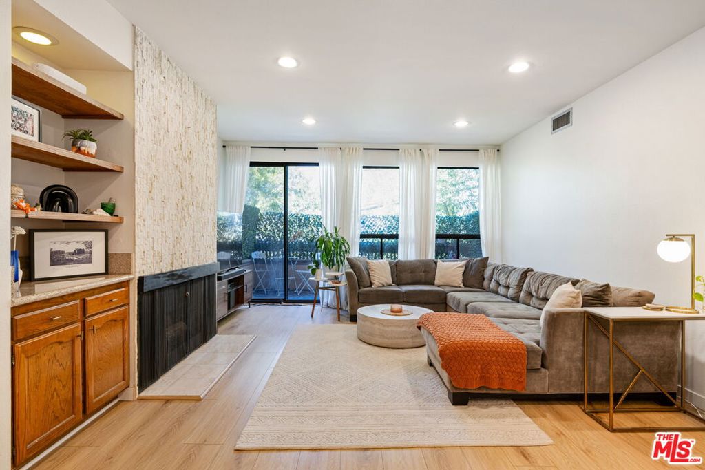 This beautifully laid-out condo offers an abundance of natural light and a thoughtful floor plan designed for comfort and privacy. The large living room is highlighted by expansive windows and a full-length balcony, creating a seamless indoor-outdoor feel and a perfect space for relaxing or entertaining. There is a wonderful open plan feel with a dining room adjacent to the kitchen and living room perfect for hosting friends. The split-bedroom layout places one bedroom and bathroom at each side of the condo, ensuring ideal separation and privacy. The primary suite features dual sinks and large closet spaces. The second bedroom also features ample closet space and nearby bath. The kitchen comes complete with a newer refrigerator and in-unit washer/dryer laundry system for convenience.Additional features include two parking spaces and a peaceful, quiet neighborhood settingdespite being just moments from the best of city living. Enjoy close proximity to UCLA, Westwood Village, Century City offices, and the shops and dining at Westfield Century City Mall.This inviting condo combines a prime location with modern amenities, offering the perfect balance of city access and neighborhood charm.