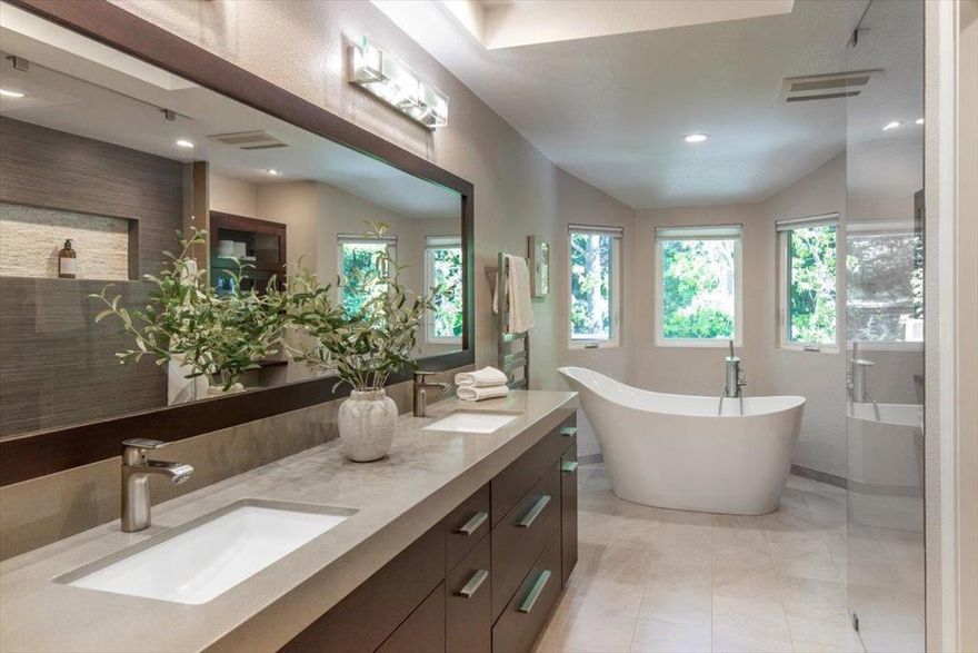 HUGE PRICE ENHANCEMENT!  Gorgeous end unit townhome in the prestigious Villas of Almaden. Enjoy the bucolic surroundings of rolling hills & glorious oak trees along w/ exclusive access to two pools, spas, tennis courts, & a clubhouse w/ billiards, ping pong, racquetball & more. Extensively remodeled over time, the modern European aesthetic of the kitchen and bathrooms will surely delight. The chef's kitchen, remodeled in 2022, includes a Thermador 36" 6 burner gas range w/downdraft, Bosch dishwasher, Fieldstone cabinets with a "magic corner" storage system, quartz counters and a Bosch Cafe Platinum Glass Smart 4-door refrigerator. The huge owners suite is a true sanctuary with vaulted ceiling and an abundance of natural light through the large windows, a fireplace, a walk in closet done by California Closets, and a spa inspired bathroom w/ frameless shower, quartz double vanity, Hans Grohe faucets, programmable towel warmer and a freestanding Aria soaking tub. Other amenities include: a bedroom/ office and full bathroom on the main floor, Milgard Tuscany windows and sliders, heated porcelain floors in the kitchen, dining and downstairs hallway, a garage w/epoxy flooring, California Closet cabinets all around & attic storage. Easy shopping and commute location