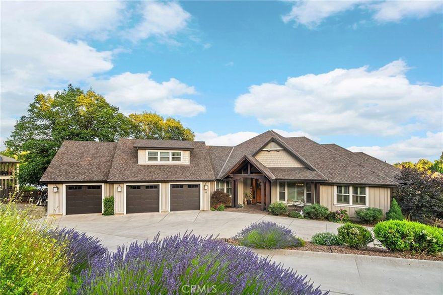 A Rare Custom Estate in One of Paradise's Finest Neighborhoods! This stunning custom-built home is a rare opportunity to own one of Paradise’s premier properties—set in a highly desirable neighborhood and nestled on approximately 2.85 acres that includes a build-ready adjacent lot. With impeccable craftsmanship, thoughtful design, and high-end amenities throughout, this home offers a lifestyle and value that simply cannot be replicated at today’s construction costs. Step inside the expansive main level (approx. 3,200 sqft), where no steps are needed to access the primary living areas and bedrooms. Rich with warmth and character, the home features solid oak wide-plank flooring, a real stone gas fireplace, custom beam work, cherry cabinetry, and intricate wood ceiling detail in the formal dining room. The gourmet kitchen is equipped with Thermador and KitchenAid appliances, granite counters, and Kohler fixtures—perfectly suited for entertaining or everyday luxury. Upstairs you’ll find a versatile loft space with a half bath, while the downstairs level offers an ideal guest suite or media/game room complete with a private entrance, full bath, and a cedar wet/dry sauna. There’s also a second single-car garage below for additional storage or workspace. Step outside to your private oasis—professionally landscaped with low-maintenance gardens, citrus and fruit trees, and raised beds. The showstopper? A Natural Design Swimming Holes saltwater pool, built in 2021, offering a peaceful retreat or a stunning setting for entertaining. Enjoy sunset views from the covered beam-deck and patio while overlooking the valley and coastal range. Built with longevity and efficiency in mind, the home boasts a 50-year presidential composition roof, owned 9.15kW solar system, zoned energy-efficient HVAC, Culligan water system, recirculating hot water, RV hookup with dump station, and fenced rear yard. Paradise is more than just a location—it’s a thriving mountain community that continues to grow in beauty, resilience, and vibrancy. Homes of this caliber, in this location, and at this price are simply not replicable in today’s market. Don’t miss the chance to make this extraordinary property your forever home.