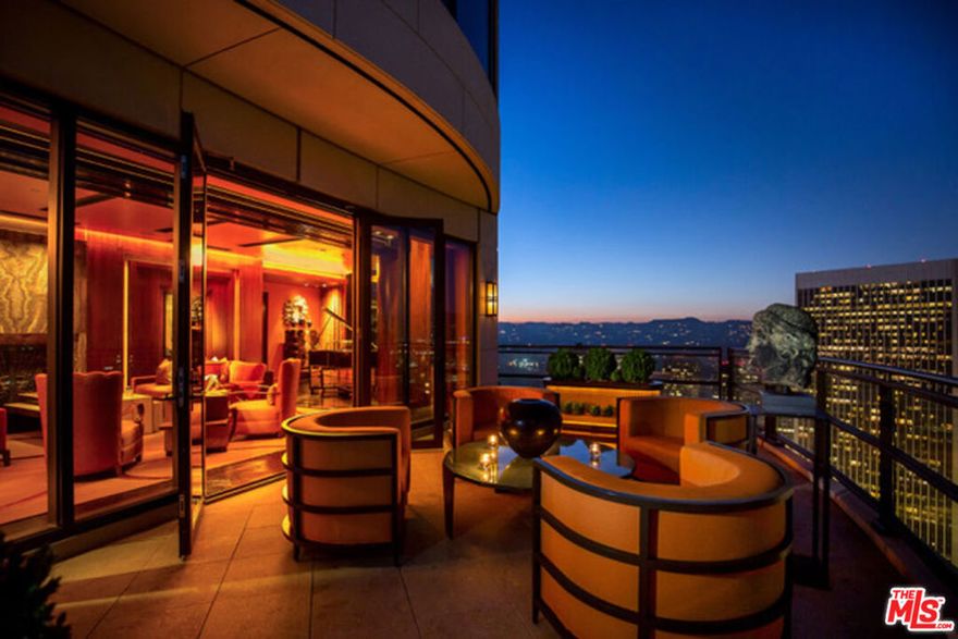 Penthouse 38B at The Century, Los Angeles' premier luxury address, is a breathtaking tribute to Manhattan-style Art Deco design and masterful craftsmanship. Perched high above Century City, this extraordinary, fully furnished penthouse offers approximately 5,320 square feet of living space with unparalleled views spanning the San Gabriel Mountains, downtown Los Angeles, and the Pacific Ocean. Entering through a private, direct-access elevator, the Grand Foyer welcomes you into a world of timeless elegance. Every detail has been meticulously designed, from the hand-carved woodwork to exquisite metal and stone finishes, evoking the glamour and romance of a bygone golden age. The residence is a true masterpiece, with seven rooms thoughtfully arranged to blend sophistication and comfort seamlessly. The nearly 600 square feet of outdoor terraces provide a commanding perspective of Los Angeles, offering jetliner views that extend as far as the eye can see. Inside, each space exudes luxury and refinement, highlighted by rare materials, bespoke fixtures, and artefact's sourced from around the globe. The current owners have curated a museum-quality collection of 1930s art, antiques, and sculptures, making this residence a one-of-a-kind offering. Penthouse 38B is a rare opportunity for the most discerning buyer to acquire the ultimate gem of Los Angeles real estate.