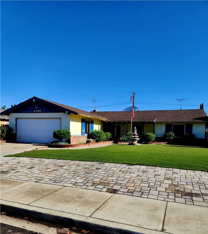 Discover the charm of this inviting single-story residence nestled in an established Riverside neighborhood. The heart of the home is a spacious living area anchored by a classic stone-faced fireplace, creating a warm and welcoming atmosphere. Flowing into the kitchen, you’ll find a generous center island with a built-in cooktop and plenty of cabinetry, providing an ideal hub for daily living. The outdoor space is a private retreat designed for enjoyment, featuring a sparkling in-ground pool and an expansive concrete patio. A covered pergola with a unique outdoor fireplace offers a perfect spot for shaded relaxation. Complete with a two-car garage and low-maintenance landscaping, this 4-bedroom, 2-bathroom home offers a wonderful opportunity to settle into the 92505 community! Buyer to verify all facts and information.