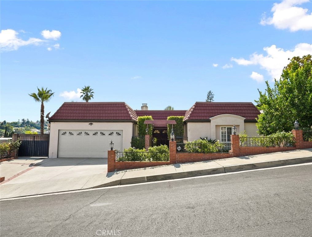 Here’s your chance to own this Exquisite Home located in the highly sought out area of Granada Hills, this home offers 4 Bedrooms/3 Bathrooms and a serene large backyard with views of the hillsides. Step inside and discover a spacious one-story layout. The heart of the home is the expansive living area, bathed in natural light streaming through large floor to ceiling double slider doors. Imagine cozy evenings gathered around the fireplace, or hosting memorable gatherings in your formal dining area with loved ones in this inviting space. The gourmet kitchen is clad with premium finishes including Granite countertops, custom tile backsplash, stainless steel appliances that include Thermador 5 burner range and double ovens, built-in microwave, island breakfast bar and a spacious kitchenette. Four bedrooms include a Primary Suite that is sure to impress features crown moldings, four separate closets, a Primary Bath with Quartz countertops, dual sinks and a shower/tub combo with custom glass enclosure. The secondary rooms are perfect for a guest-bedroom, gym or office. Other features include, surround sound speakers in living room, inside laundry room and a 2-car garage. Relax, unwind, or entertain your guests in your private backyard with Pebble-tec pool. The expansive outdoor space provides a perfect setting for outdoor gatherings, barbecues, or simply unwinding under the Pergola. Low maintenance backyard with hardscape pavers, elevated sitting area and an abundance of fruit trees give it a serene atmosphere offering an escape from the hustle and bustle of everyday life. Located in the Kennedy High School, Frost Middle School and El Oro Elementary School district. Explore nearby parks, hiking trails, and recreational amenities, or venture into the vibrant city center for shopping, dining, and entertainment. Come see this property before it’s too late!