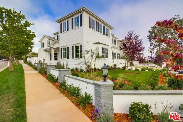 Stately Clark Remington-designed brand new East Coast Traditional on a wide corner lot in the Upper Alphabet Streets near the soon-to-be-completed Caruso Village. There is exquisite attention to detail in this 7 bedroom, 8 bath home complete with high ceilings and abundant natural light. This luxurious home offers two family rooms, a wood paneled den and formal dining room with coffered ceilings, breakfast nook, and walk-in pantry. The kitchen is stunningly appointed with quartz-top center island and Wolf/Subzero appliances. The family room has French doors leading to the covered patio and grassy yard with pool & spa. The master suite is graced with fireplace, balcony, and spa-like bath with freestanding tub. There is an en suite main level bedroom and 3 upstairs en suite bedrooms. The basement features 2 bedrooms, 2 baths, home theater, family room and elevator to all interior floors. Enjoy the sunsets from the expansive roof deck with ocean & mountain views.