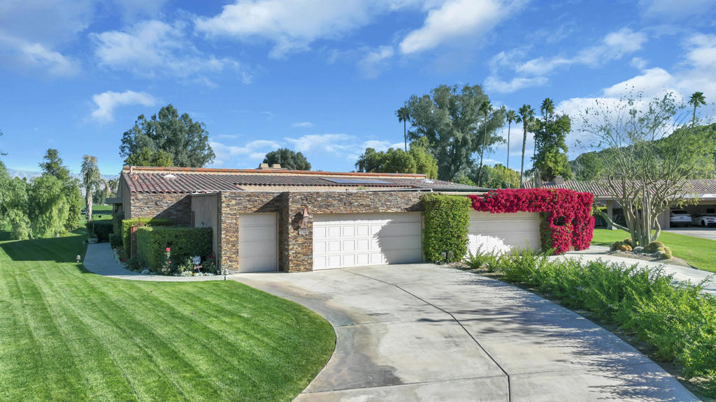 Charming & traditional furnished Sandpiper Cove Condo, 2008 Sq. Ft., 2 Bedroom, 2 Bath, plus a Home Office has sublime mountain & fairway views within the prestigious Indian Wells CC. The beautiful ledge rock exterior with long driveway makes an elegant statement for this Condo with an outstanding location. Travertine floors & stone baseboards throughout, custom shades & plantation shutters, lots of recessed & track lighting. Double door entry into Great Room with awesome views of mountains & double fairway of the 9th & 18th holes. Great Room features gorgeous chandelier, a wall of glass sliders for outstanding views, high beamed ceilings, lovely stone fireplace, built-in custom cabinetry galore including spacious desk. Direct access to private, spacious, covered brick patio which has built-in BBQ island with granite countertops, great bar seating, & mesmerizing golf and mountain views. Formal Dining has high ceiling & marvelous views. Open Kitchen features high granite countertops, full stone backsplash, floor to ceiling custom cabinetry, stainless appliances, bar seating, & big garden window for panoramic views. Primary Bedroom Suite has a large, mirrored wardrobe & walk-in closet, travertine shower, dual sinks, & granite counters. Primary Suite has a walk-out to quaint, private brick courtyard with enchanting ledge rock fireplace & mountain views. Guest Bedroom has spacious ensuite bath with dual sinks, & glass sliders out to enjoy the beautiful, warm & cozy courtyard.