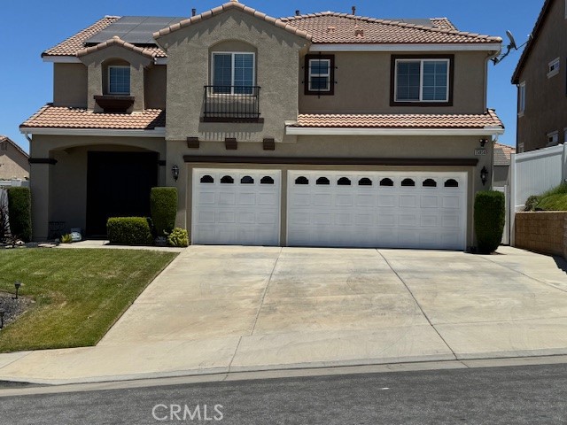Gracious Two-Story Home with Abundant Living Space: This expansive residence offers a thoughtful floor plan with five bedrooms and three full baths. The main level features a convenient guest and bathroom, ideal for overnight guests or multigenerational living. The heart of the home is an open kitchen with an island, double ovens, a cooktop stove, dishwasher, garbage disposal, and ample cabinetry as well as a pantry. An in-kitchen dining area and double patio doors create easy flow to the backyard, while the kitchen’s open layout connects seamlessly to a cozy family room anchored by a fireplace and ceiling fan. Upstairs, the generous primary suite includes a fireplace, dual walk-in closets, two separate vanities, and a private bathroom with a jetted tub, shower, and enclosed toilet. The upper level also includes, three additional bedrooms, a full guest bathroom, a dedicated laundry room with sink and storage. The upper level is complete with a spacious carpeted loft, with an adjacent office area, perfect for remote work or study. Outdoors, the landscaped front yard enhances curb appeal, and the back patio provides a welcoming space for entertaining, with an included shed for extra storage. There are solar panels as well. This home blends functional design with comfortable living, making it ready for your next chapter.