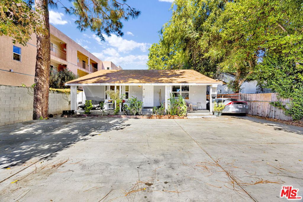 Exceptional Investment Opportunity with LAR3 zoning! This fabulous detached multi-residential duplex is truly an investor's dream, offering the exciting potential to build more units (buyer to verify). The front unit -14541 Hart - is thoughtfully set back from the street and comes with the convenience of four front parking spaces. This unit features 2 bedrooms and 2 baths, and has some updates including central AC. The kitchen has granite counters and ample cabinetry. The detached back unit - 14539 Hart - offers 1 bedroom and 1 bath, complete with window AC units for those warm summer days. Two rear parking spaces are included for added convenience. Nestled between these units is a 120 square foot storage shed, providing extra space for your storage needs. Moreover, the property features a detached garage with ready, approved, and paid plans for conversion, offering the potential to be transformed into an additional unit, which could bring in extra income. A large yard space behind the garage unit enhances the property's outdoor appeal. This amazing investment could be a valuable addition to your real estate portfolio, or serve as a home with additional income to offset the mortgage payment. The location is prime, providing easy access to shopping, public transportation, local freeways, and more! Whether you are looking to offset your mortgage or build a multi-unit property, this can be your perfect opportunity!