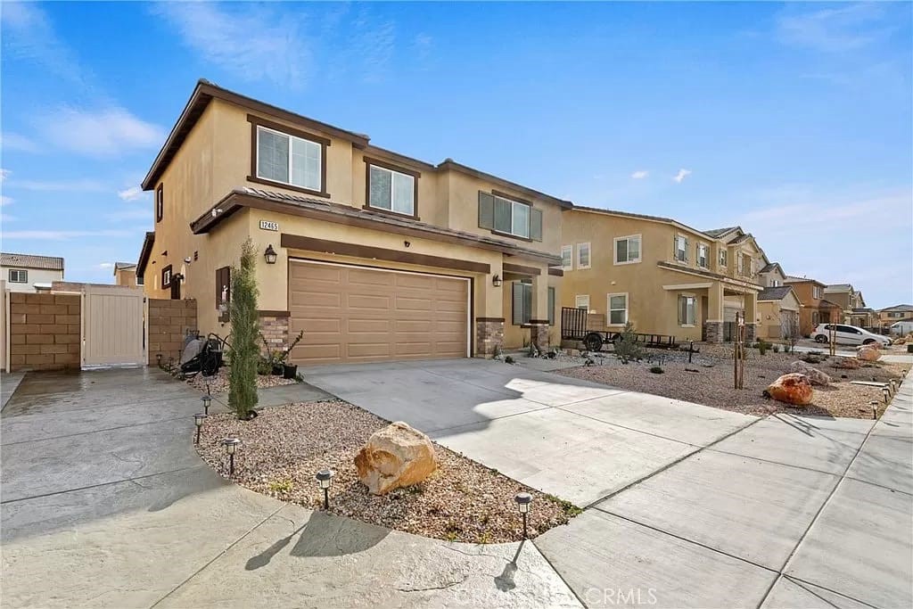 Beautiful house with open floor plan, with 3335 sf of gross living space, great for family gatherings. 5 Bedrooms 4 Bath. one bedroom and office downstairs with 3 bedrooms, 2 bathrooms upstairs. Ceramic tile through the house and carpet in bedrooms. Spacious Family room upstairs with new stairs rail. Dining room and Living room on first floor have cozy fireplace for cold winters. Backyard it's a must see, it has a built-In Gas Barbeque with small fridge, and a good size Covered patio with ceiling fan to enjoy with your family every evening during the summer. Pictures show before and after backyard upgrade. Gorgeous build-in rock water fountain for relaxing days or nights. Sprinkle system to water trees and grass. Storage Shed in backyard. You will fall in love with this gorgeous house!!
