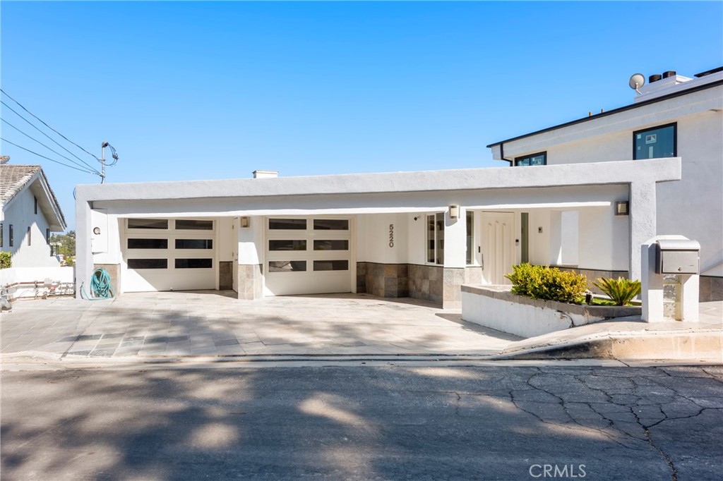 Light-filled and thoughtfully updated, this 5-bedroom, 4-bathroom home in Woodland Hills offers 2,850 square feet of flexible living space with sweeping views and a layout designed to adapt to modern life. Set on a quiet street, the property includes a spacious three-car garage plus driveway parking for an additional two vehicles, making it ideal for multi-car households or frequent guests.
Designed with versatility in mind, several rooms feature bifold doors that allow spaces to transform based on your needs. Whether it's a home office, content studio, guest suite, or gym, the layout supports a wide range of uses. The main level includes a welcoming family room with fireplace, a modern kitchen with breakfast bar, and a dining area surrounded by oversized windows that capture city and hillside views.
The primary suite offers a sense of calm and privacy with its own fireplace, balcony, generous closets, and a clean, modern en-suite bath. Additional bedrooms are well-sized and bright, including a guest suite on the first level with its own bathroom and separate outdoor access.
Multiple balconies throughout the home provide quiet spaces to unwind, work outdoors, or entertain with a view.
Recent upgrades include luxury vinyl flooring, LED lighting, fresh paint, a gas-powered large-capacity water heater, and a two-zone HVAC system for efficient year-round comfort.
For those needing extra space, a separate one-bedroom, one-bathroom unit is also available to rent at an additional cost. Perfect for extended family, a private office, or a creative studio.
Located just minutes from Ventura Boulevard, the 101 Freeway, Whole Foods, and some of the Valley’s best dining and shopping, this home offers a rare blend of privacy, flexibility, and convenience with room to grow.