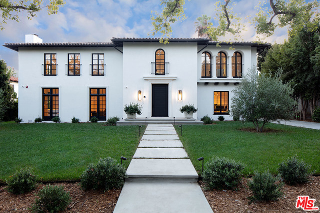 Situated on the most idyllic street in all of the Beverly Hills Flats, this striking 1927 Spanish recently underwent a 3-year remodel and expansion. Inside you are greeted by a, sun-drenched, 2-story entry foyer with 20 foot long skylights on either side. The main floor encompasses a dramatic living room with a custom wood burning Carrara fireplace, paneled library with pocketing doors that reveal a hidden Nero Marquina bar, spacious family room, open kitchen with a built-in banquette, butler's pantry and a formal dining room. There are 5 en suite bedrooms in the main house, plus a separate 1-bedroom guesthouse in the back that overlooks the pool and luscious lawn. This well thought out smart home features endless amenities to suit today's lifestyle. Don't miss your chance to acquire the most beautiful home on North Maple Drive. Shown to pre-qualified buyers. Also available for lease.