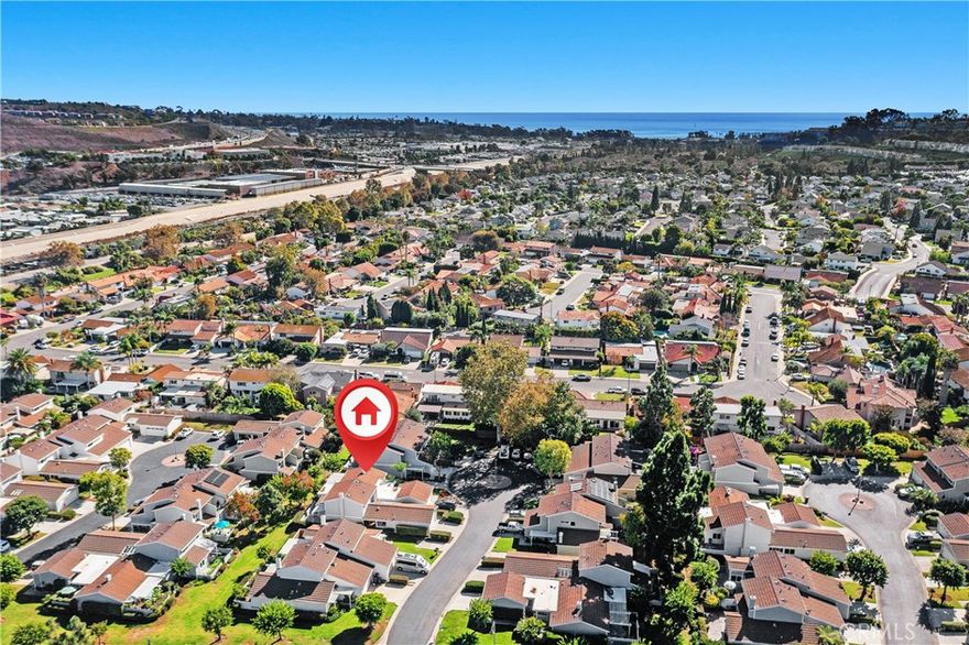 Upgraded Single-Family Residence – You Own the Land! This end-unit, duplex-style townhome is nestled in a quiet cul-de-sac within the highly desirable Mariner Village community. Classified as a Single Family Residence (attached), this home offers the benefits of land ownership with the low-maintenance lifestyle of a townhome. Inside, you'll find a thoughtfully reconfigured kitchen featuring brand-new appliances, recessed lighting, and updated fixtures throughout. Additional upgrades include new luxury vinyl flooring and refreshed bathrooms, making the home clean, modern, and move-in ready. The home currently offers 3 bedrooms, 2 bathrooms with a main floor primary bedroom with en-suite and another primary bedroom with en-suite upstairs. Some neighbors have added a third bathroom upstairs, transforming the layout a 3 bathroom home! Ask for details! Community amenities include: •Sparkling pool and spa •Spacious clubhouse •Tennis and pickleball courts •Dedicated Boat/RV parking lot •Tree-lined greenbelts and cul-de-sac streets. Just minutes from Old Town San Juan Capistrano and Downtown Dana Point, this location offers the perfect blend of tranquility and accessibility. HOA covers: •Roof maintenance •Exterior paint •Driveways and street slurry •Greenbelt and tree care •RV/Boat lot and court upkeep. Don’t miss the opportunity to live in one of the area’s most sought-after communities! This home sits on one of the least congested streets in the tract.