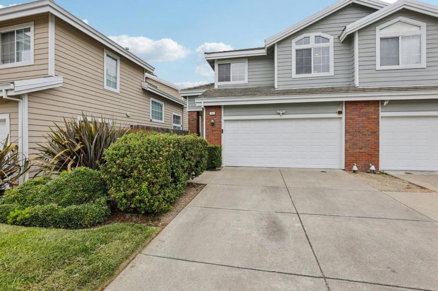 Welcome to this stunning townhome in the desirable Village Parkway Community of Hercules. This inviting two-story residence features vaulted ceilings, a designer color palette, and abundant natural light throughout. The spacious floor plan includes a formal living and dining area ideal for entertaining and everyday comfort. The modern kitchen is updated with quartz stone countertops and all major appliances. Wood flooring was installed in 2017, adding warmth and elegance to the home. A convenient inside laundry, a hallway white cabinet for extra storage, and an attached oversized two-car garage provide functionality and convenience. The garage is further upgraded with LED lighting, a MyQ-compatible opener, and an updated insulated garage door. Upstairs offers three full-size bedrooms, two and a half updated bathrooms, and a loft with an office area perfect for a peaceful and productive workspace. Outside, the rear and side yards have been concreted for easy access, with dedicated gardening space and a working drip sprinkler system. Additional upgrades include central AC for year-round comfort. The community is just a short stroll to public transportation, shopping, banks, and scenic walking and biking paths