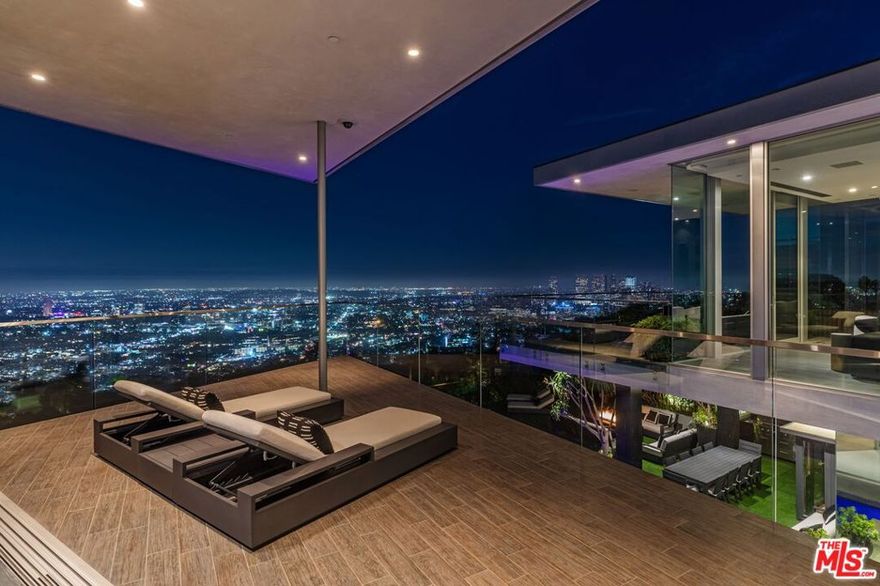 This is one of the most iconic estates in the Bird Streets, showcasing jaw-dropping architecture by Paul McClean and explosive views of the entire city from every room. A true celebrity compound, it has been home to some of the most powerful names in the industry; and you could be next. Designed for ultimate living and entertaining, the residence features a theater, entertainment lounge, poker room, and a professional music studio designed by music virtuoso, Avicii. If these walls could talk, they'd say dream big and live bigger. Homes of this caliber rarely come to market. Call today for your private showing.