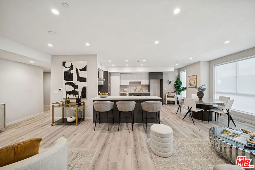 Stylish corner condo with private patio in a new luxury building in prime Pico-Robertson! Residence 204 offers 3 bedrooms and 3.5 baths of modern sophistication. Designed with privacy in mind, this sun-filled home features high ceilings, minimal common walls, and contemporary finishes throughout. The open-concept kitchen showcases European-style cabinetry, quartz countertops, a professional-grade appliance suite with five-burner cooktop, double oven, and a sleek double-basin sink. The spacious primary suite boasts a walk-in closet with custom built-ins and a spa-inspired bath adorned with quartz finishes, porcelain tile, and Delta fixtures. Two additional bedrooms offer flexibility for guests or a home office. Smart-home upgrades include Nest thermostat, in-unit LG washer/dryer, and smart wiring. Wide-plank modern flooring completes the look. Residence 204 includes tandem parking in a secure garage and is part of an exclusive 19-unit corner collection. Located near Beverly Hills, Century City, and the 10 Freeway. Tenant pays gas, electric, and trash. Water included. Pets OK. Available now.