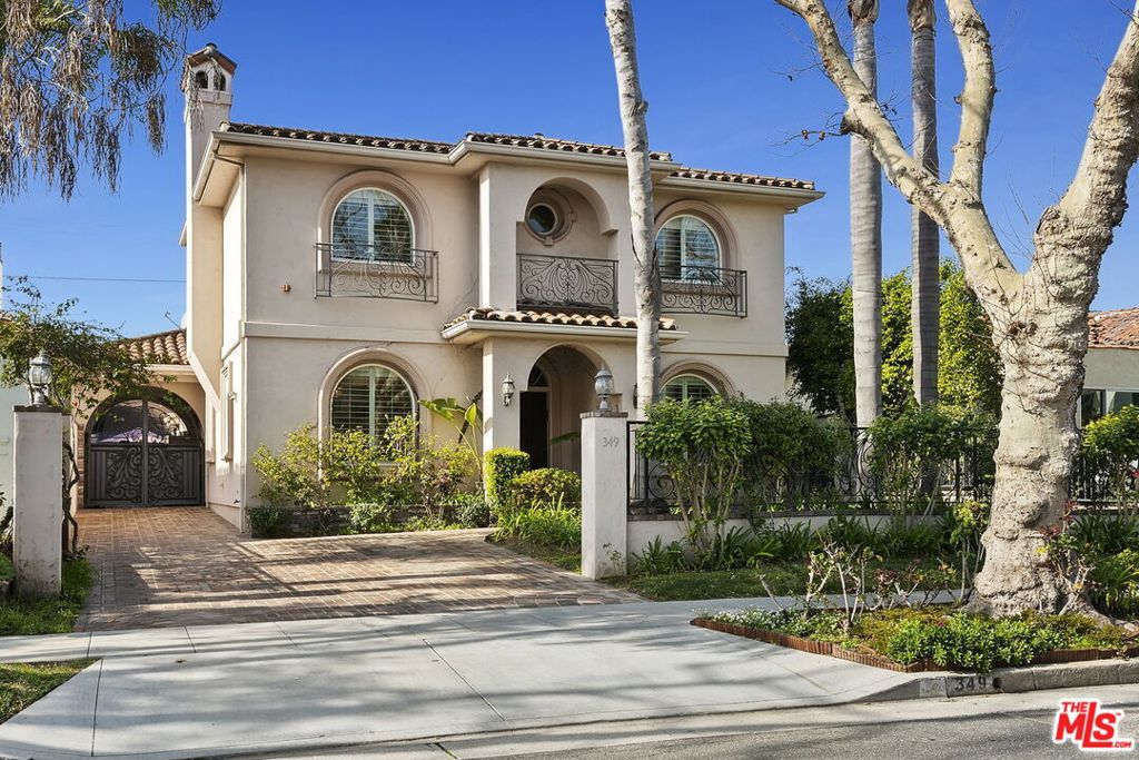 A newly renovated spacious bright Mediterranean-style villa set in the heart of Beverly Hills. Beautiful 2-story 4 bed/4.5 bath spacious home with stunning curb appeal, designed with an ideal spacious floor plan, perfect for entertaining. Enclosed front yard with brick hardscape and driveway. Formal entry with high ceilings closet and powder room. Living room with fireplace and built-in bar opens to large formal dining room overlooking front yard. Family room with wall of built-ins & desk/office area opening to kitchen and sliding door to backyard with beautiful brick patio and palm tree landscape. Chef's kitchen includes granite countertops, butler's pantry with 2nd sink, stainless steel appliances including double ovens and gas range top, and separate breakfast room overlooking backyard. 1 bedroom with ensuite full bath downstairs with separate entrance, and 3 additional bedrooms upstairs including oversized primary suite with large custom finished closet, sitting area and spa-like bathroom with separate tub and shower, and 2 separate private bathrooms/sinks. 2 laundry areas upstairs and 2 additional bedrooms with ensuite full bathrooms. Additional features include dual pane windows, dual zoned ac/heat, 2 large walk-in storage closets upstairs, crown molding and plantation shutters throughout, large skylight in hallway. Gated driveway. This is a gorgeous home in a prime area of Beverly Hills with easy access to the best schools, shopping and restaurants Beverly Hills has to offer. *Fully furnished option available if needed.